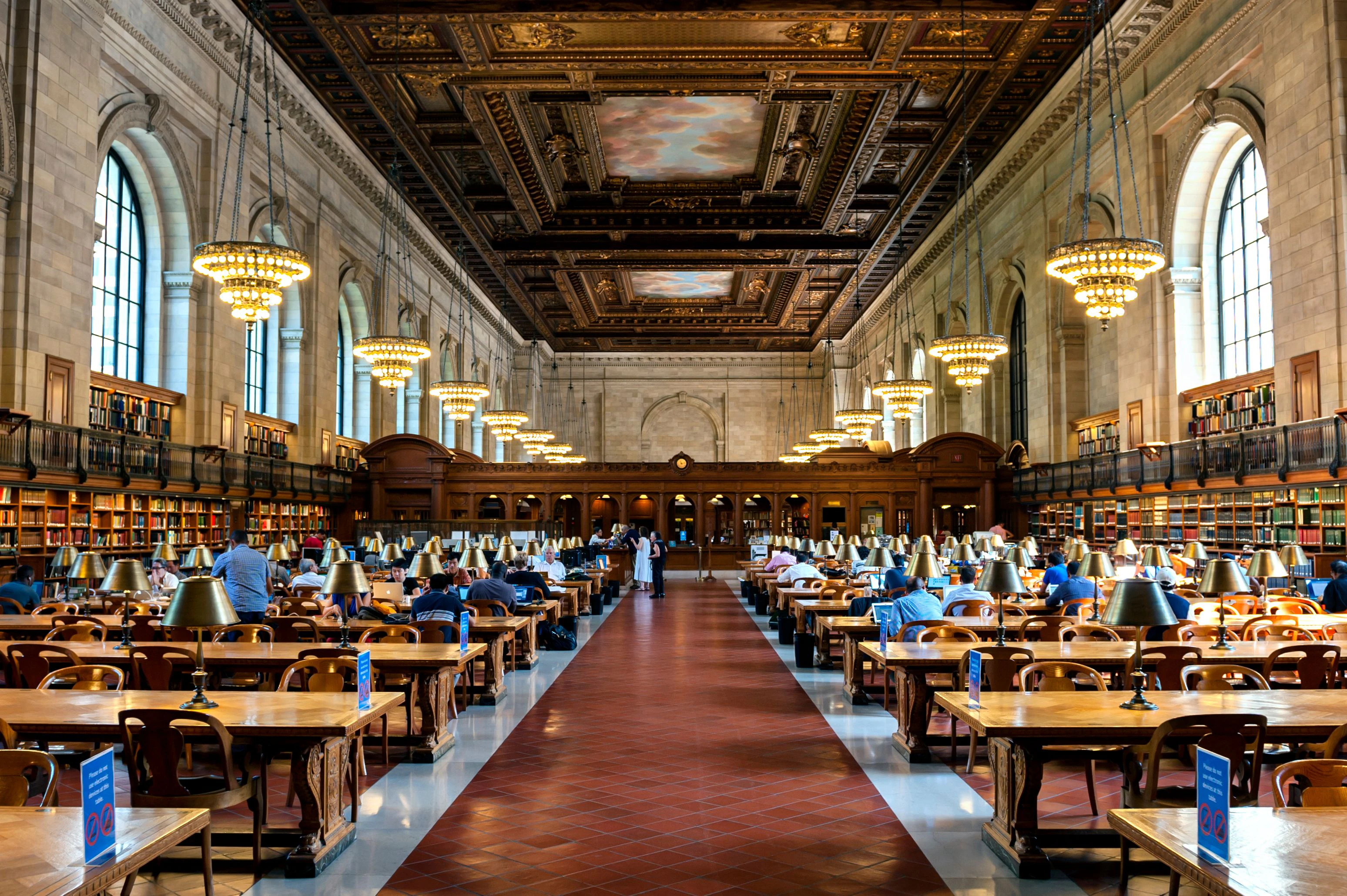 New York, United States - September 11, 2013: people study in the New York Public Library on September 11, 2013 in Manhattan, New York City. New York Public Library is the third largest public library in North America.
