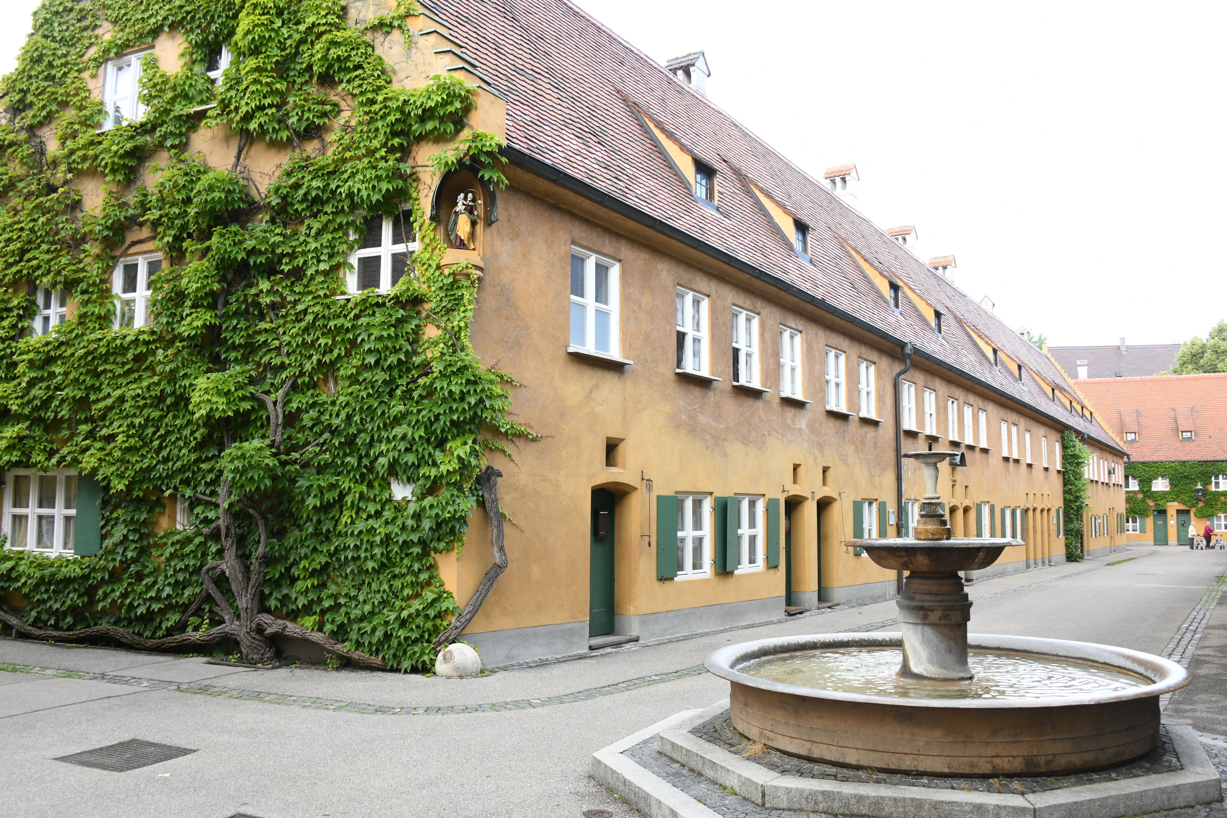 The Fuggerei in Augsburg was donated by Jakob Fugger in 1521. The row house settlement is the oldest existing social housing estate in the world. It celebrated its 500th anniversary in 2021 