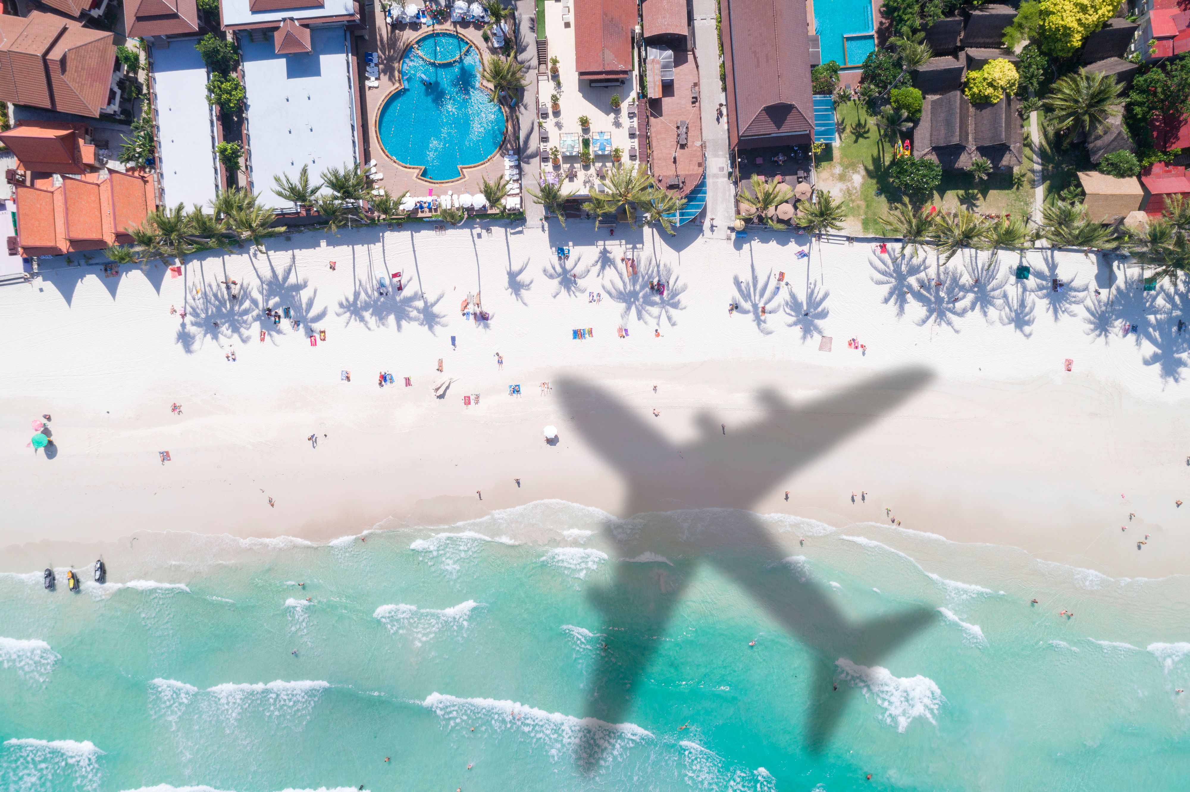 Airplane's Shadow over a Crowded Beach, Full Moon Party Beach Haadrin, Koh Phangan, Thailand. Converted from RAW.