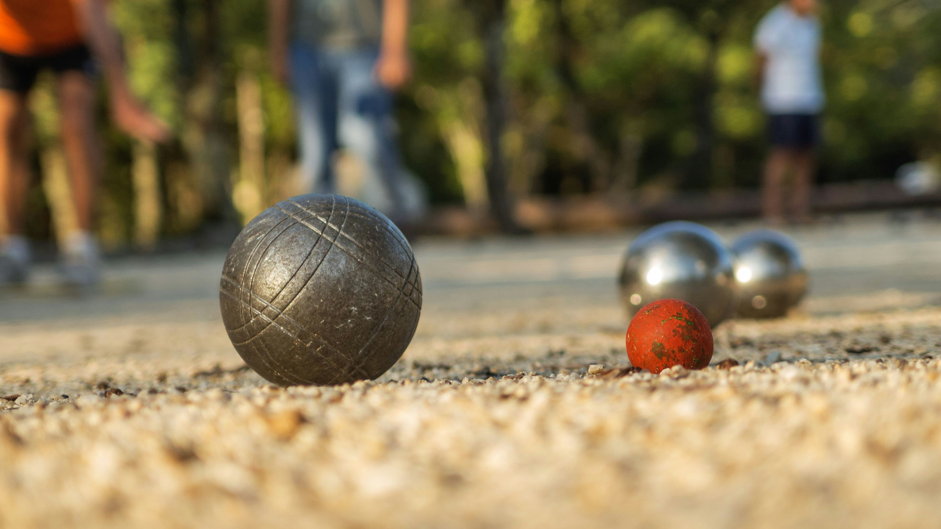 Playing Boules Game / Petanque in France