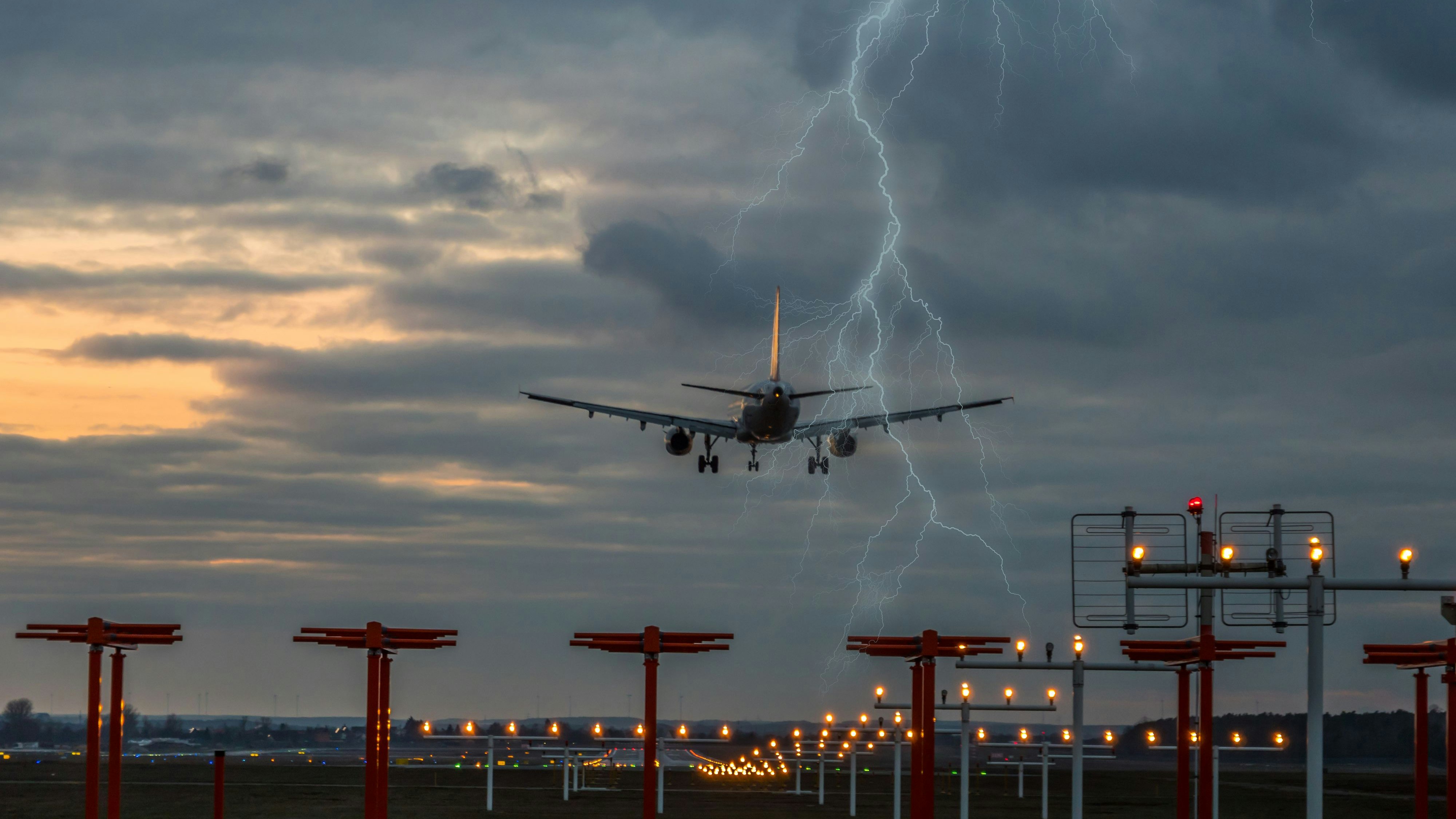 Thunderstorm on landing airplane at the airport