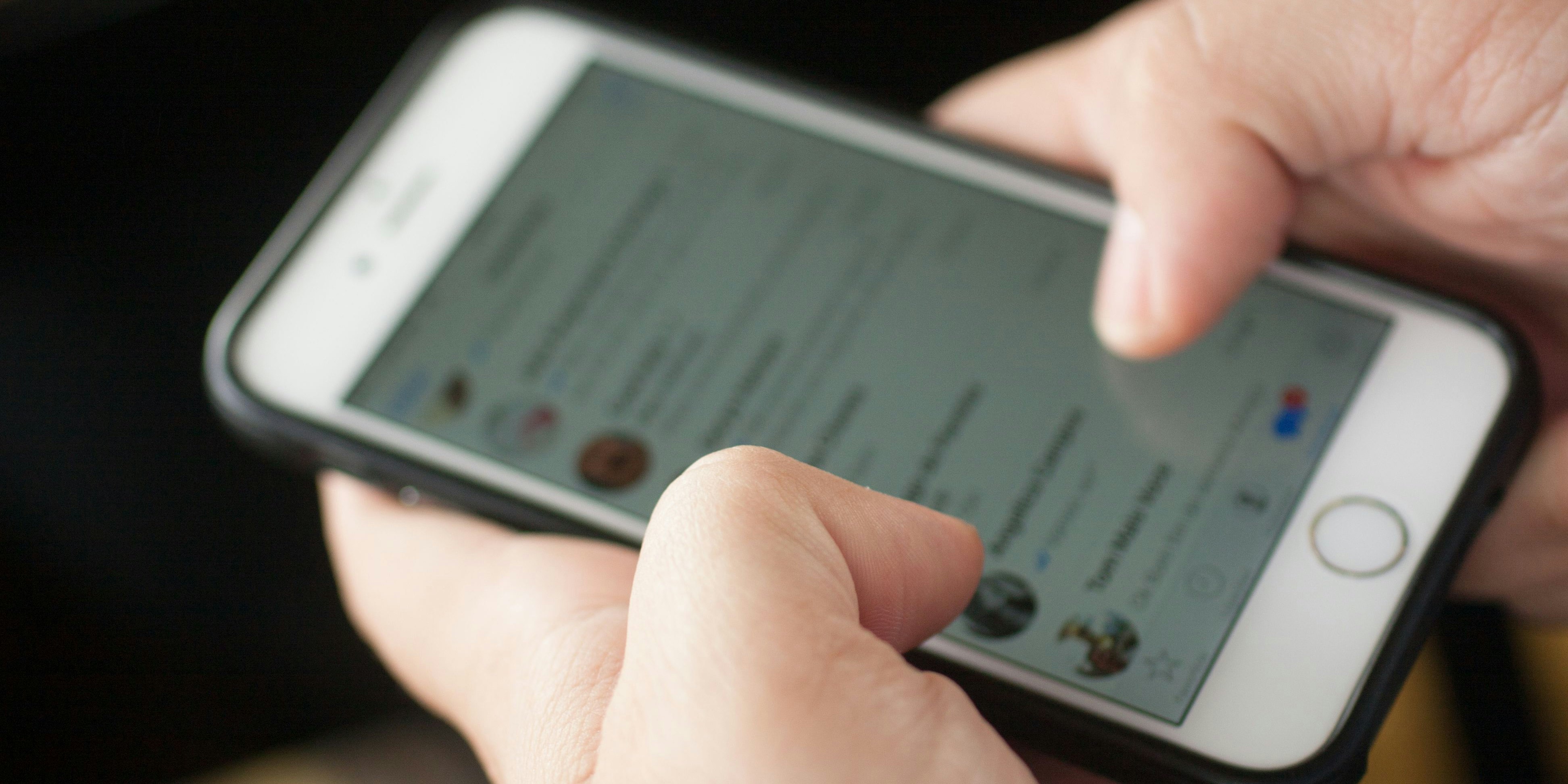 Rio de Janeiro, Brazil - June 4, 2016: Men typing in Whatsapp or text mensage