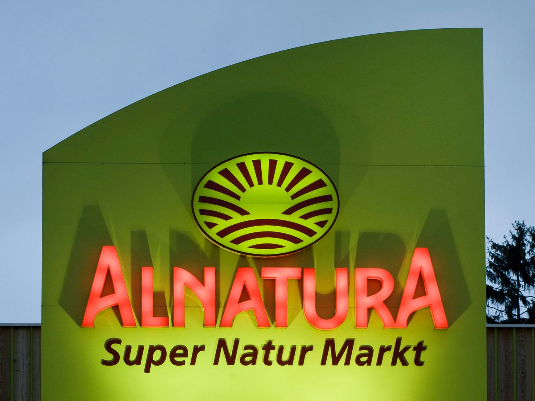 Wiesbaden, Germany - March 18, 2011: Illuminated sign and entrance of Alnatura Store. Alnatura is a german chain of health food stores that primarily sells health and organic foods from local produce and products grown without usage of pesticides. Alnatura operates 48 stores in the southwest of Germany