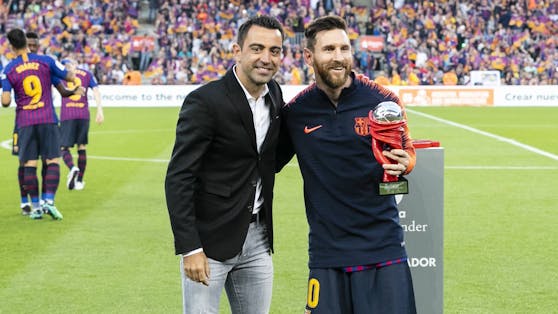 Xavi Hernandez mit Lionel Messi