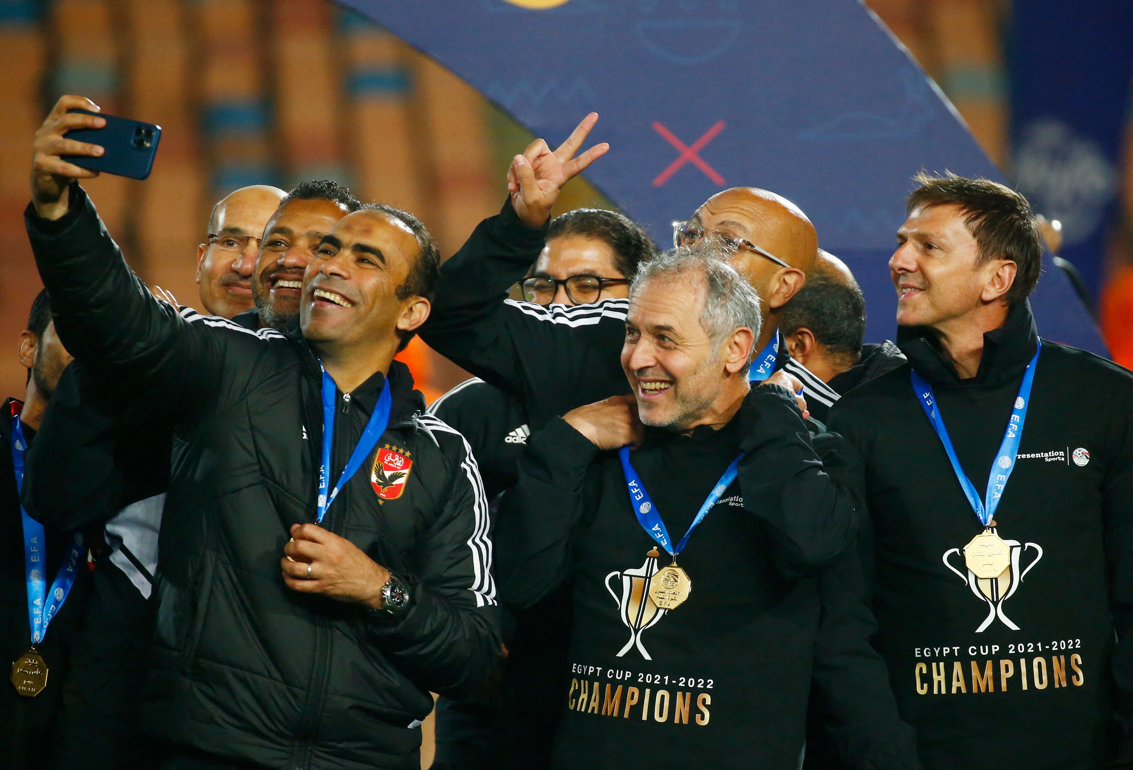 Soccer Football - Egypt Cup Final - Pyramids v Al Ahly - Cairo International Stadium, Cairo, Egypt - April 10, 2022   Al Ahly caoch Marcel Koller and his staff celebrate after winning the Egypt Cup REUTERS/Amr Abdallah Dalsh