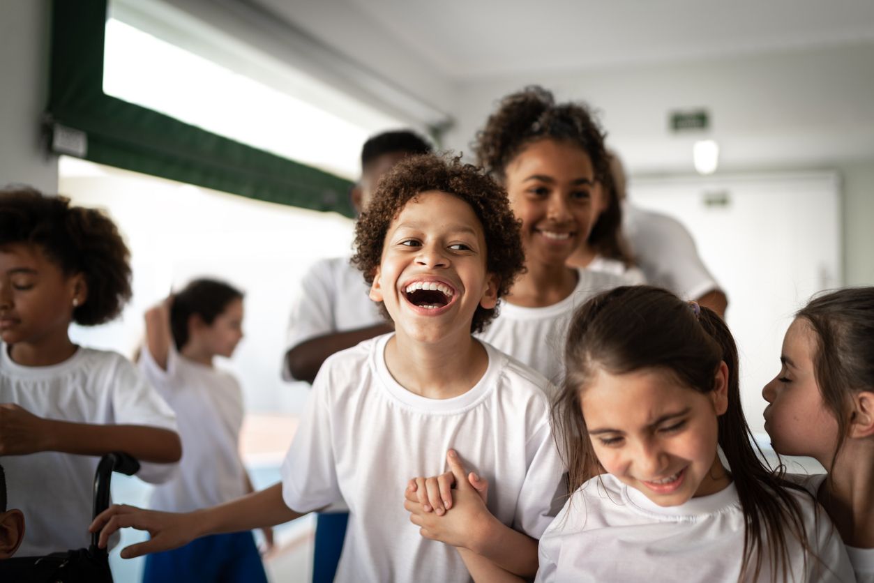 Group of elementary students having fun during break time
