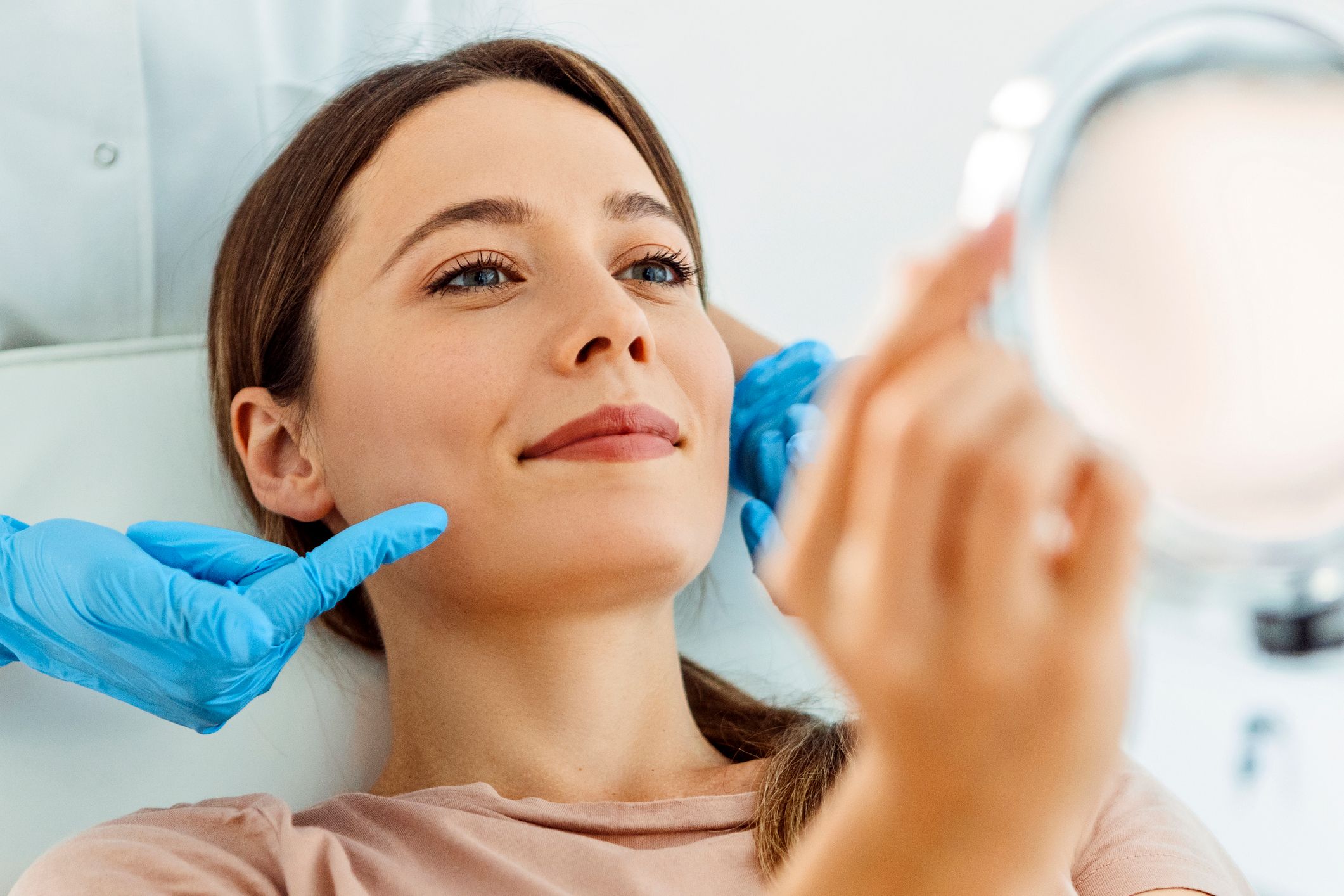 Young Beautiful Woman Having Various Facial Treatment