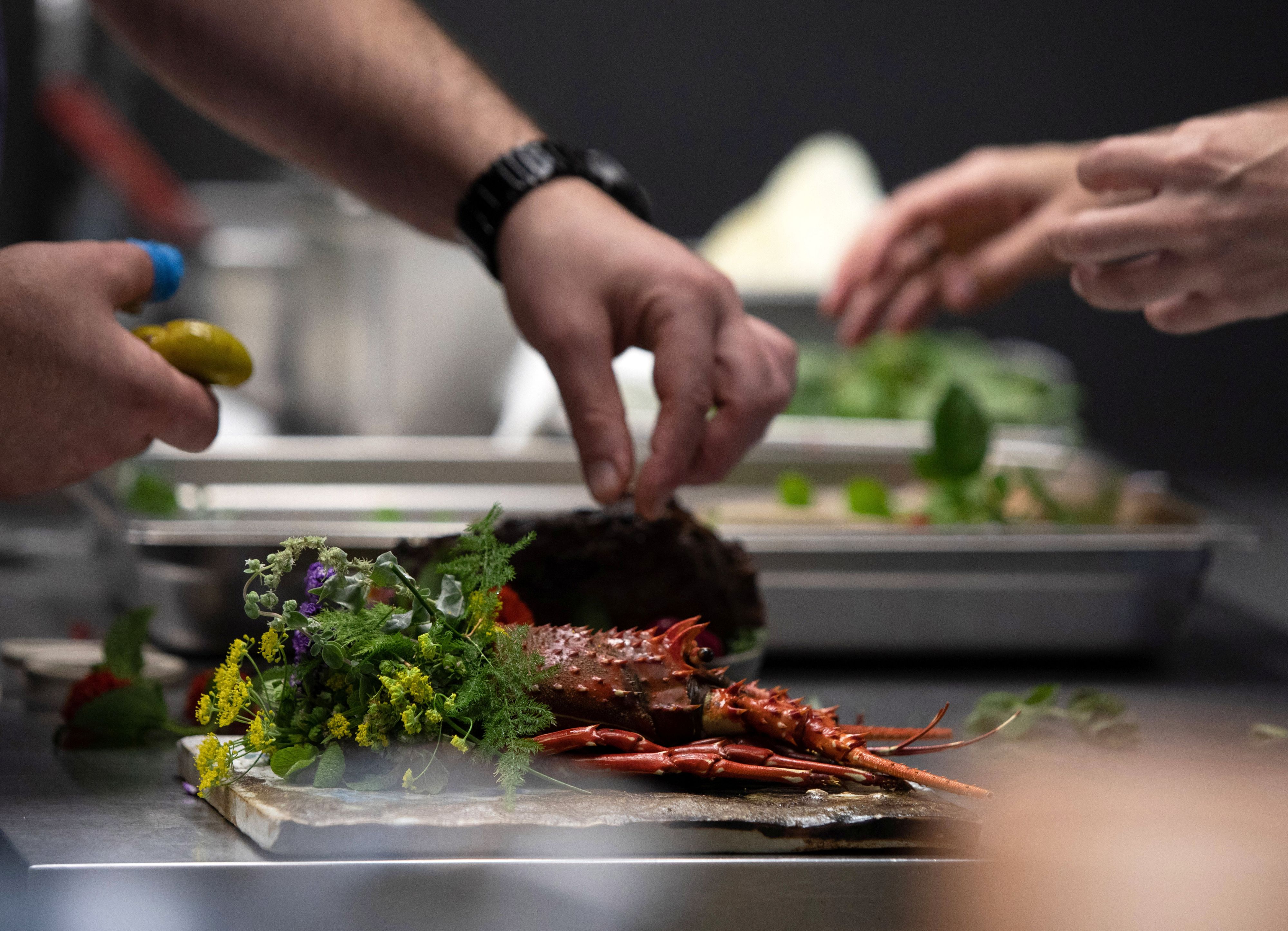 Staff prepare dishes at restaurant Central in Lima, Peru January 28, 2021. Picture taken January 28, 2021. REUTERS/Angela Ponce