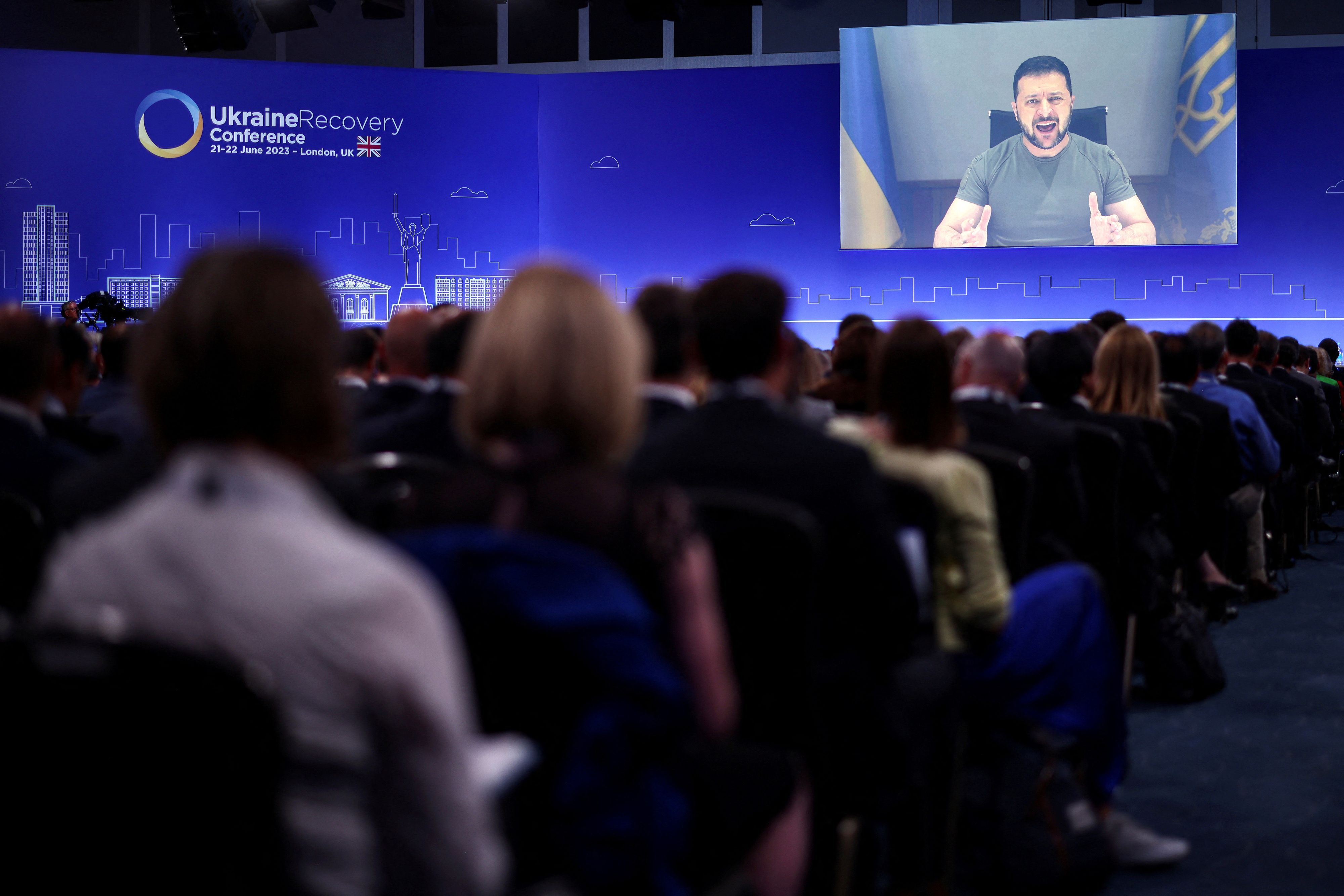 Ukraine's President Volodymyr Zelenskiy delivers a speech via videolink at the opening session on the first day of the Ukraine Recovery Conference in London, Britain June 21, 2023. Leaders and representatives from more than 60 countries are in London for a two-day conference to secure funding to help Ukraine recover from the ravages of war.     Henry Nicholls/Pool via REUTERS