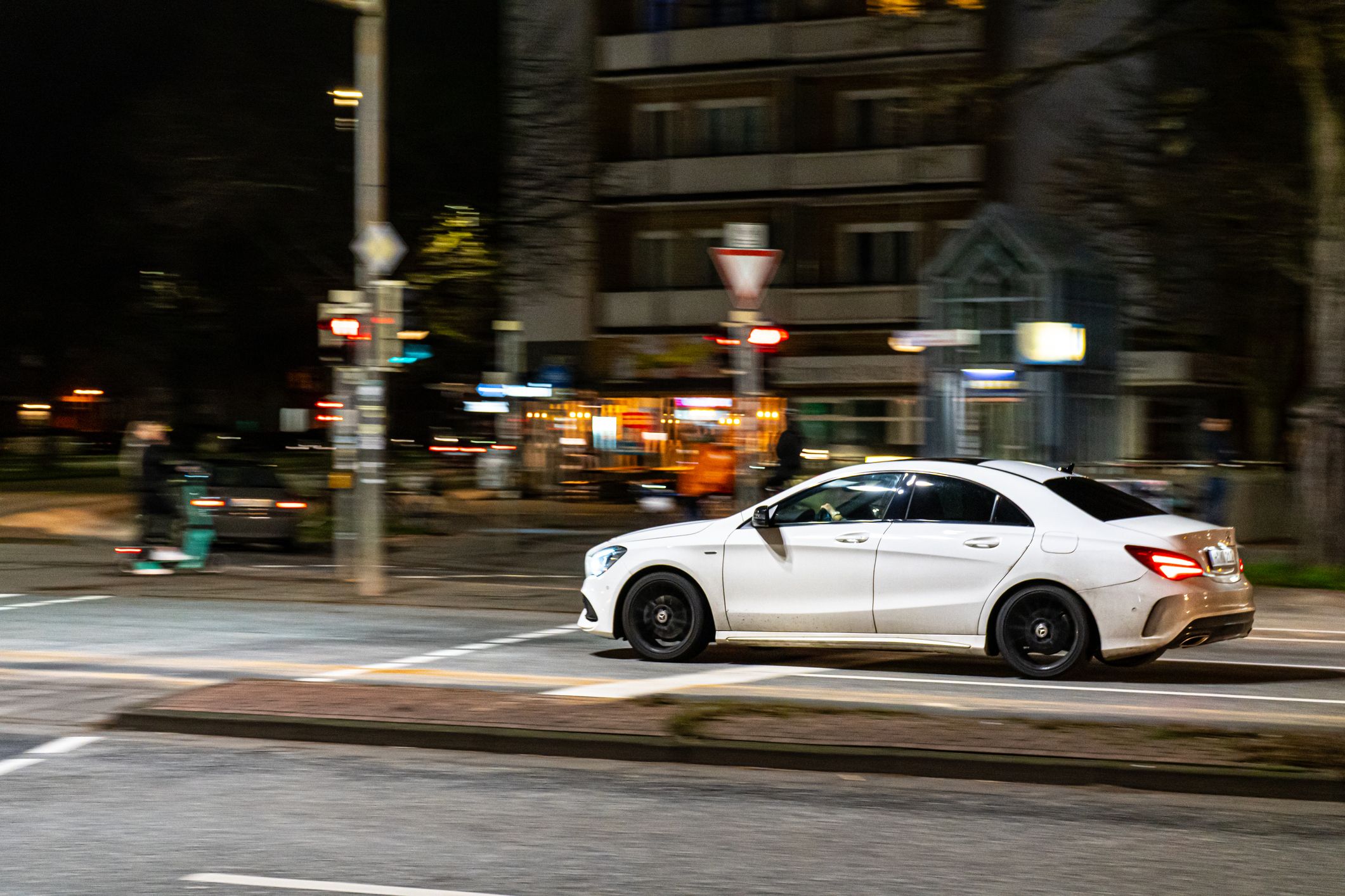 Hannover, Germany – January 01, 2022: The black Mercedes drives through an intersection of Hannover, Germany