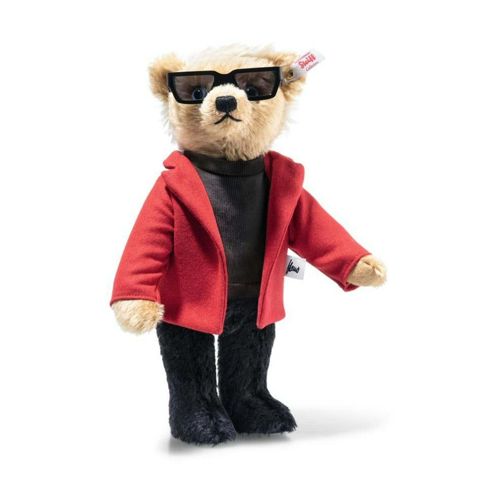"Darüber trägt der Heino Teddybär ein rotes Sakko aus feinem Wollstoff, unter dem der schwarze Rolli hervorblitzt", heißt es auf seiner Homepage.