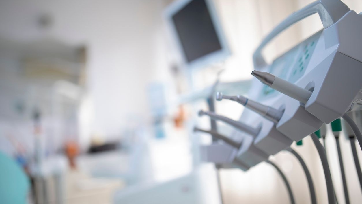 Dental chair and equipment. Patient reception room in a modern medical center. Detail view selective focus