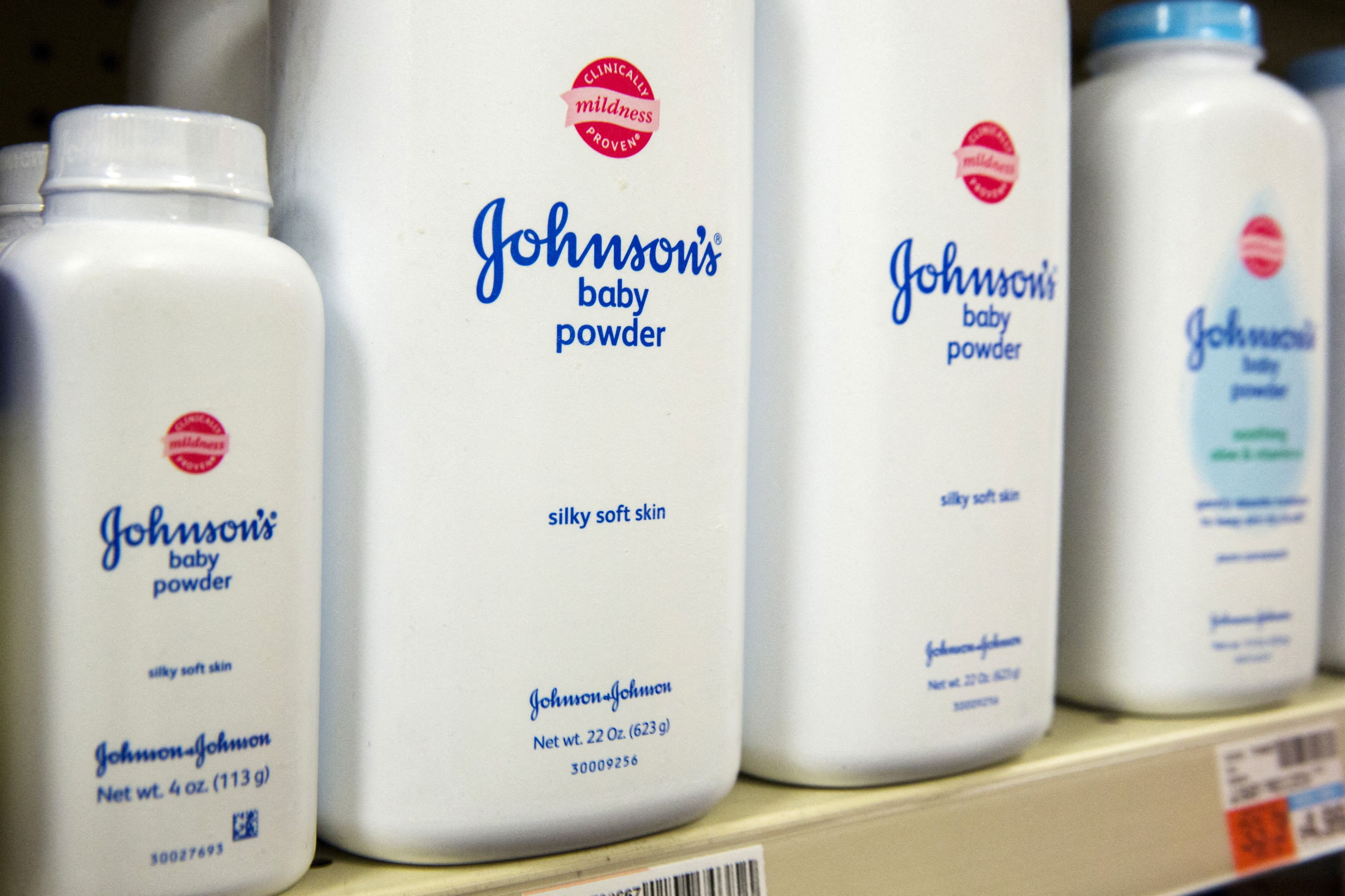 FILE PHOTO: Bottles of Johnson & Johnson baby powder line a drugstore shelf in New York October 15, 2015.  REUTERS/Lucas Jackson//File Photo