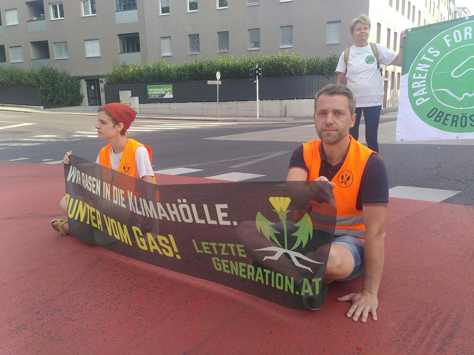 Bilder des Straßenprotests der Letzten Generation in Linz am 24. Juli 2023.