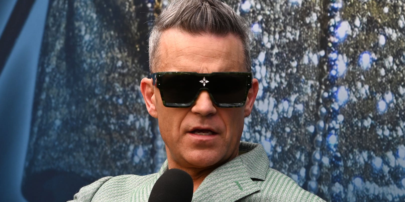 Robbie Williams hat eigene Ansichten zum Umgang mit KI.