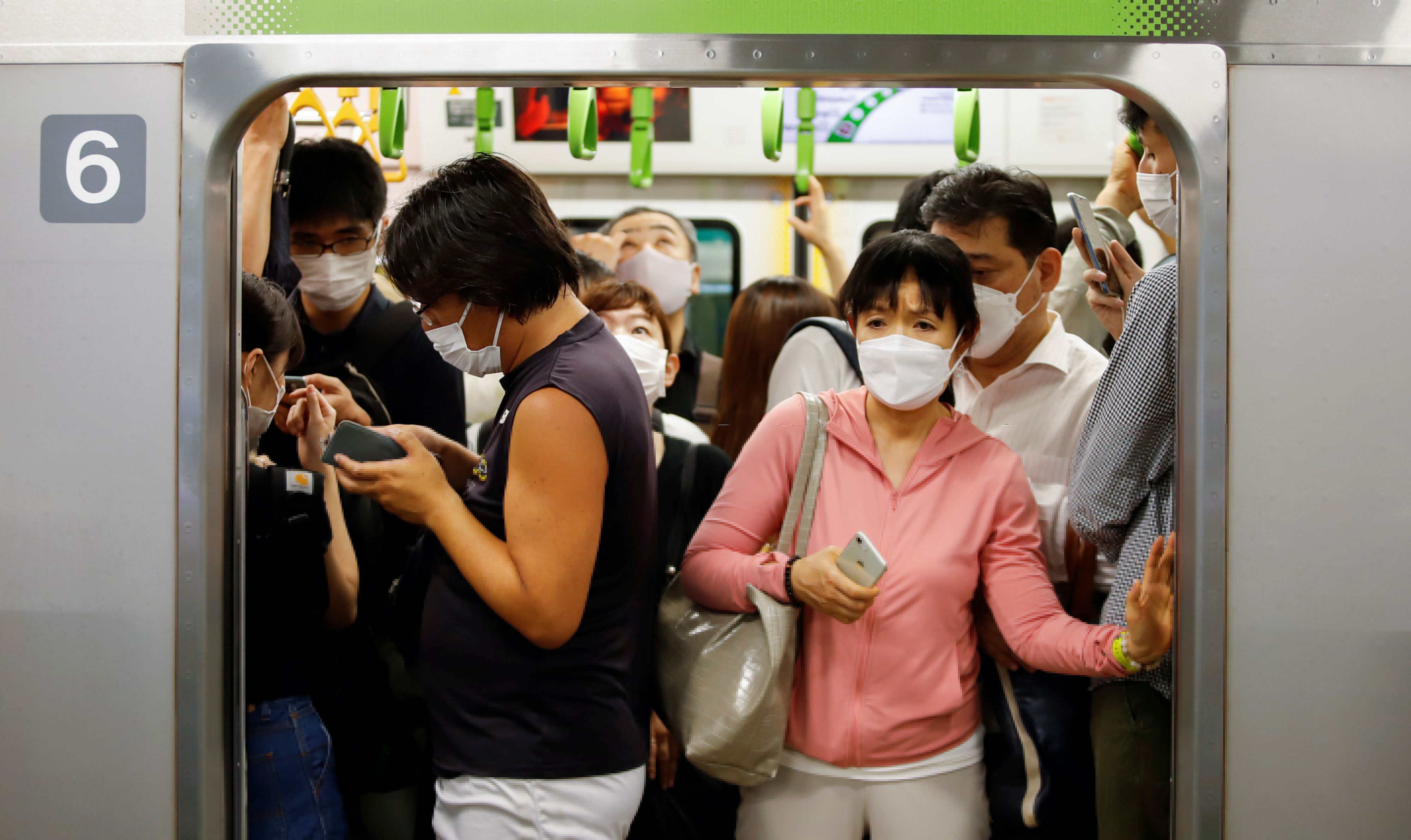 Rush hour on Yamanote line train, in Tokyo, Japan. July 30, 2021 REUTERS/Androniki Christodoulou