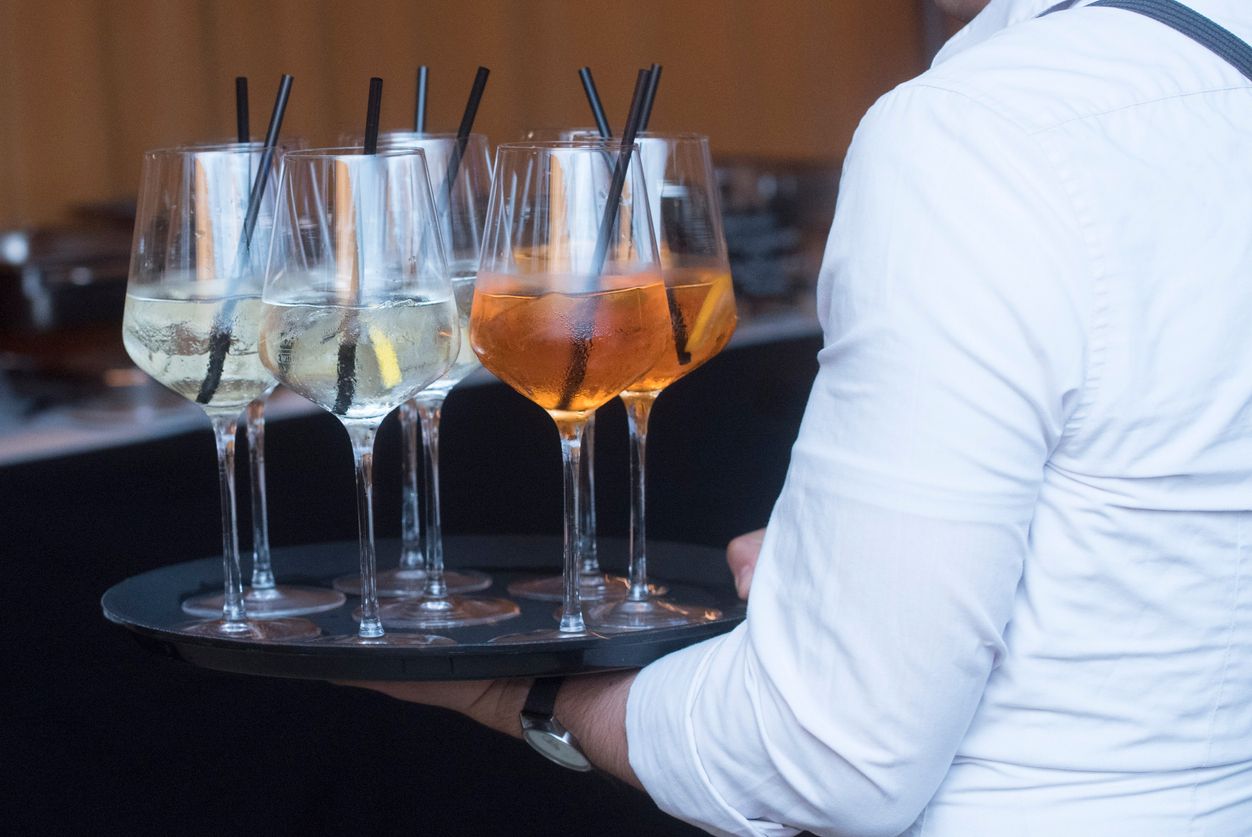 waiter as service staff for serving orders to the customer in gastronomy and tourism