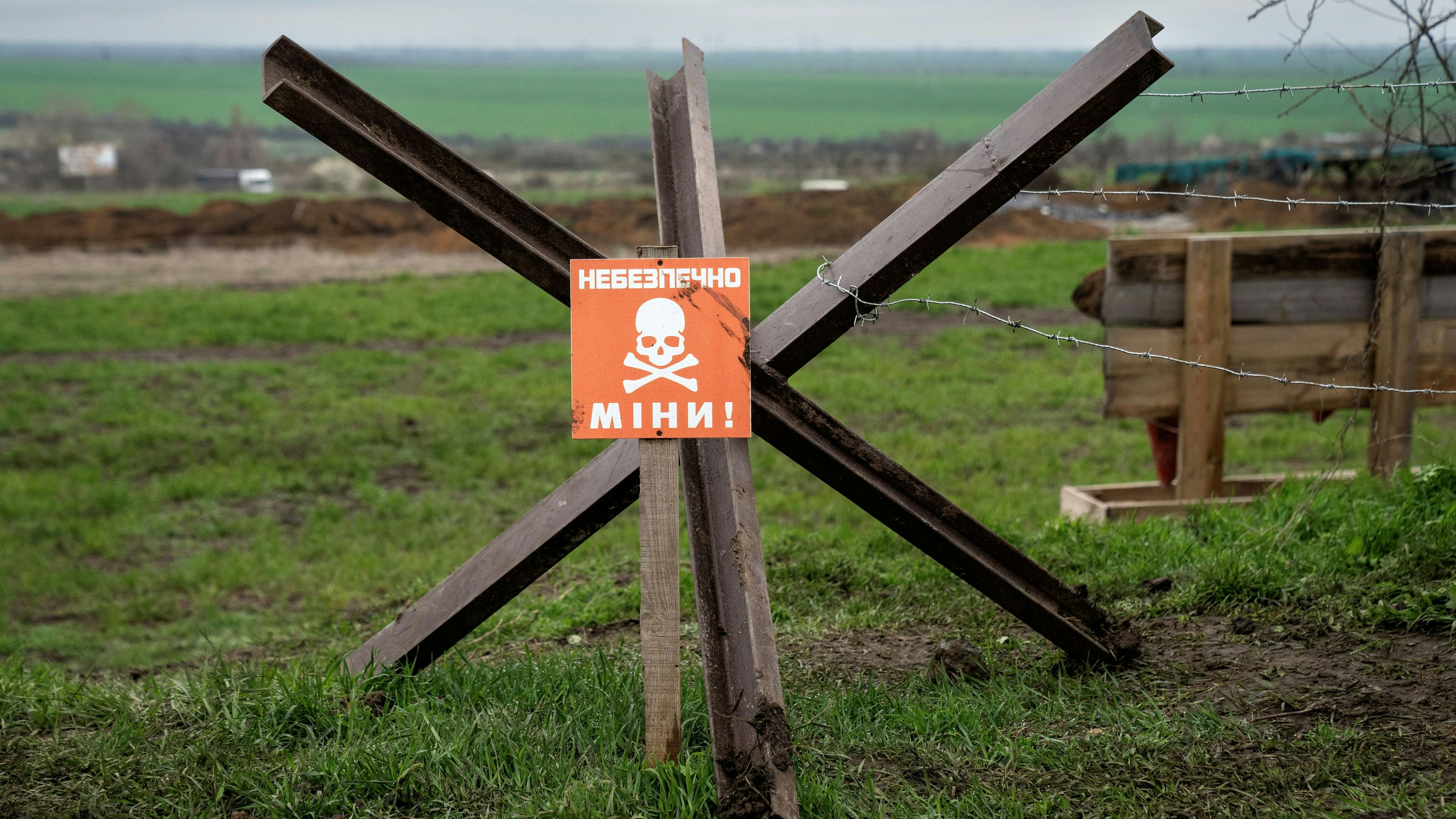 A sign warning of a minefield stands near a defence position, where Ukraine's National Guard prepares to defend Odessa, if Russia chooses to attack in this direction, in Odessa, Ukraine, April 10, 2023. Ritzau Scanpix/Bo Amstrup via REUTERS    ATTENTION EDITORS - THIS IMAGE WAS PROVIDED BY A THIRD PARTY. DENMARK OUT. NO COMMERCIAL OR EDITORIAL SALES IN DENMARK.