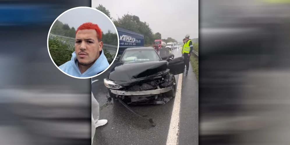 Barello vor dem kaputten Wagen.