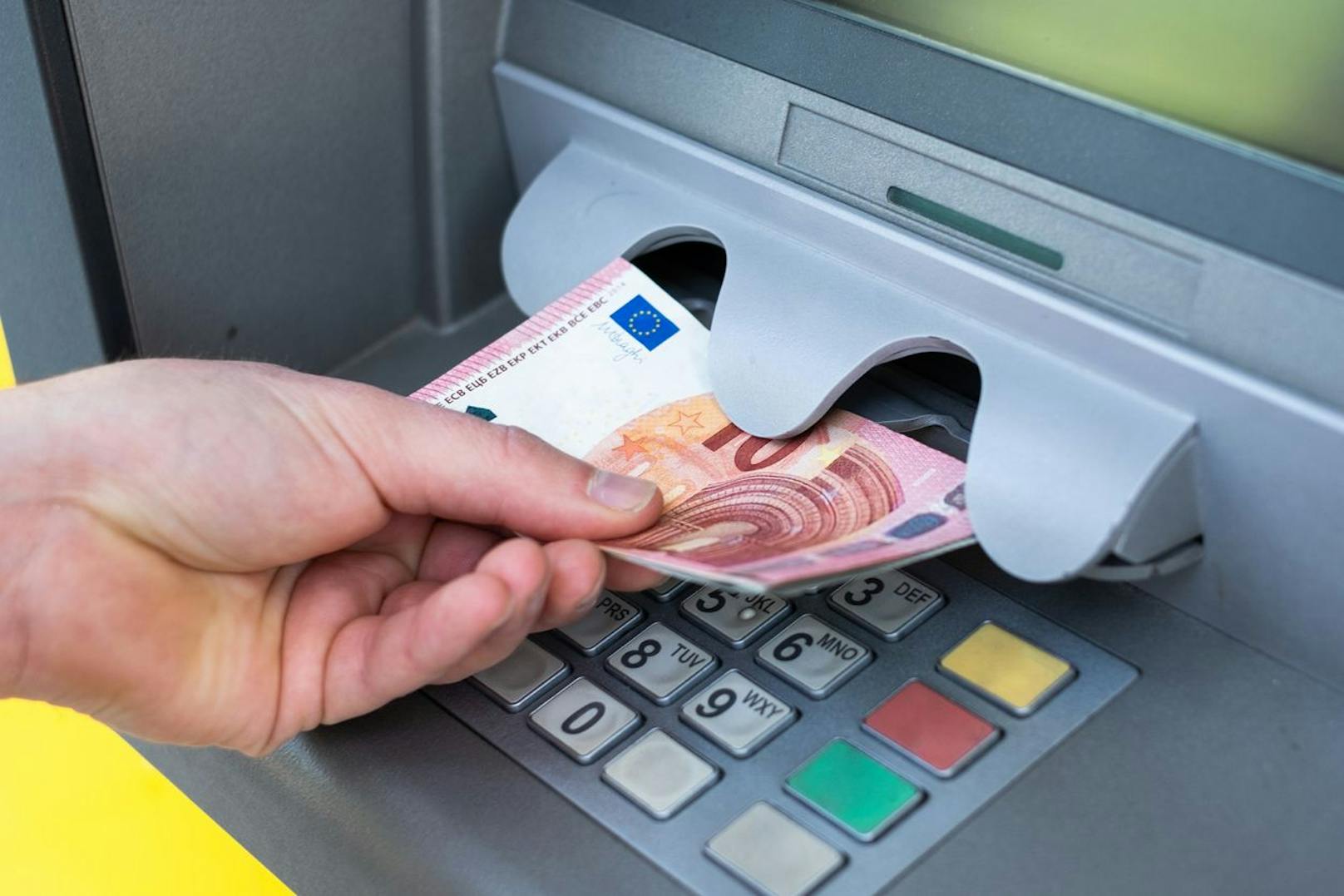 Bank and people concept with close up of hands choosing option on atm machine