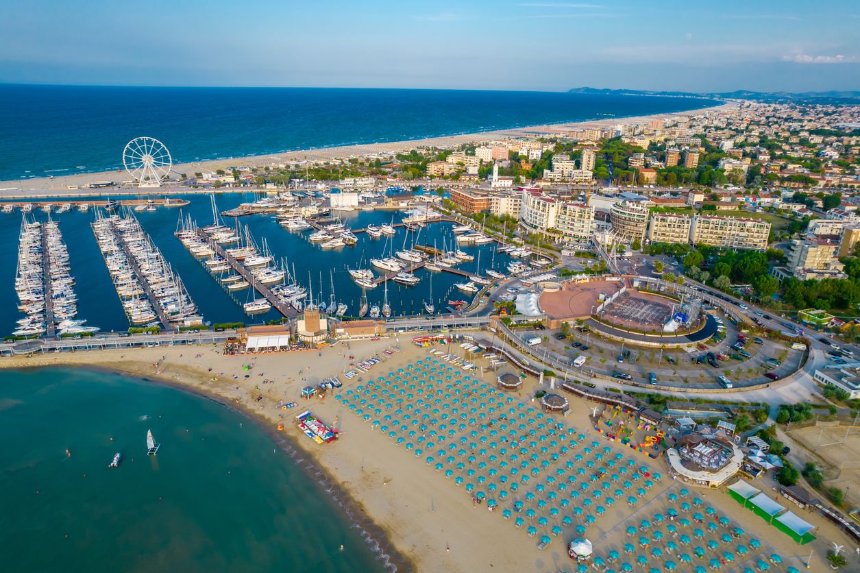 Aerial photo of the coastline and canal of the resort of Rimini on a sunny day
