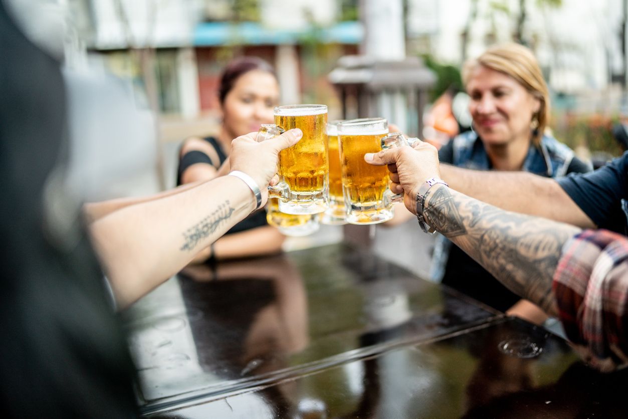 Friends making a celebratory toast on a pub