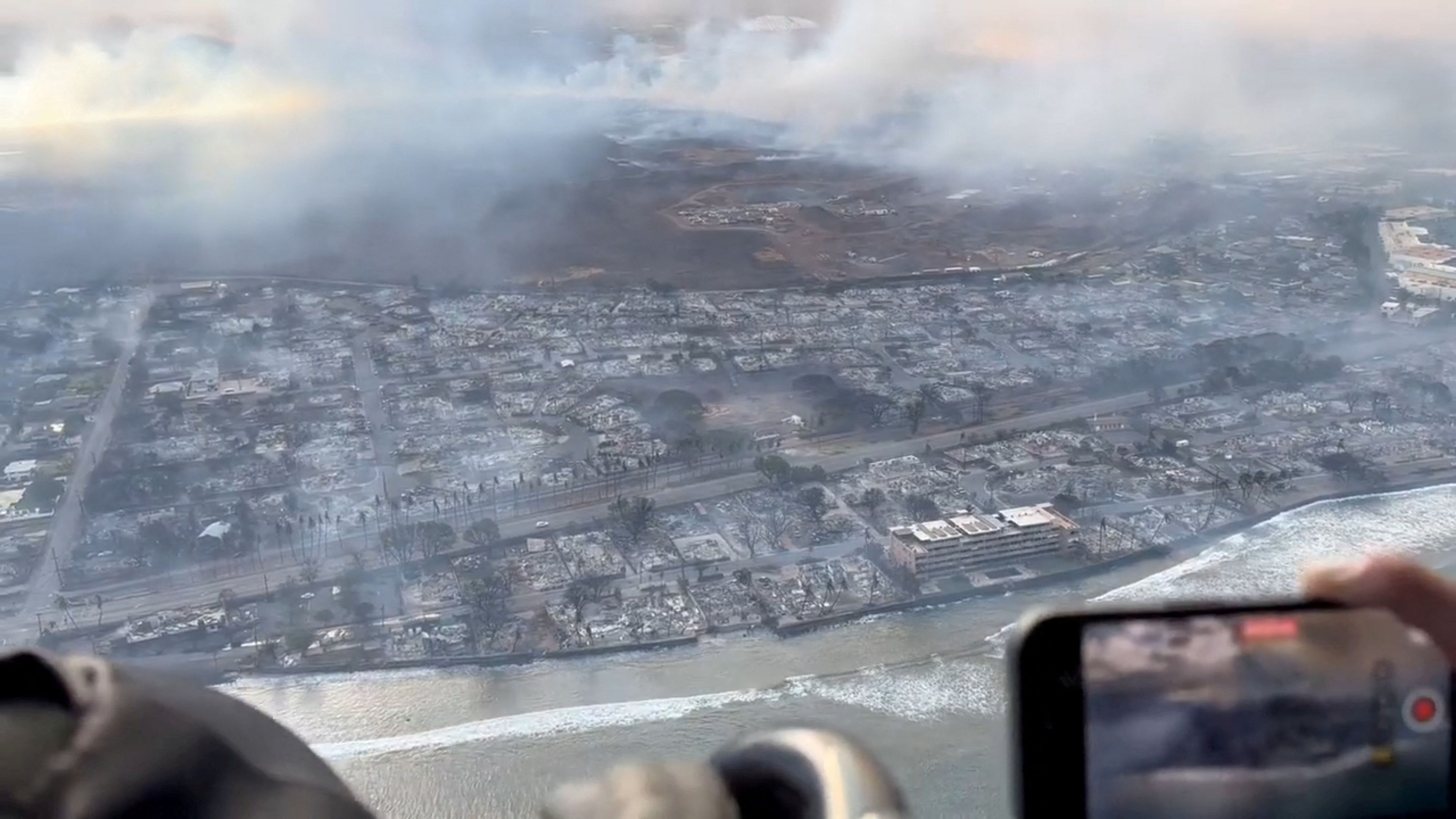 An aerial view shows damage along the coast of Lahaina in the aftermath of wildfires in Maui, Hawaii, U.S. August 9, 2023 this screen grab obtained from social media video. Richard Olsten/Air Maui Helicopters/via REUTERS  THIS IMAGE HAS BEEN SUPPLIED BY A THIRD PARTY. MANDATORY CREDIT. NO RESALES. NO ARCHIVES.