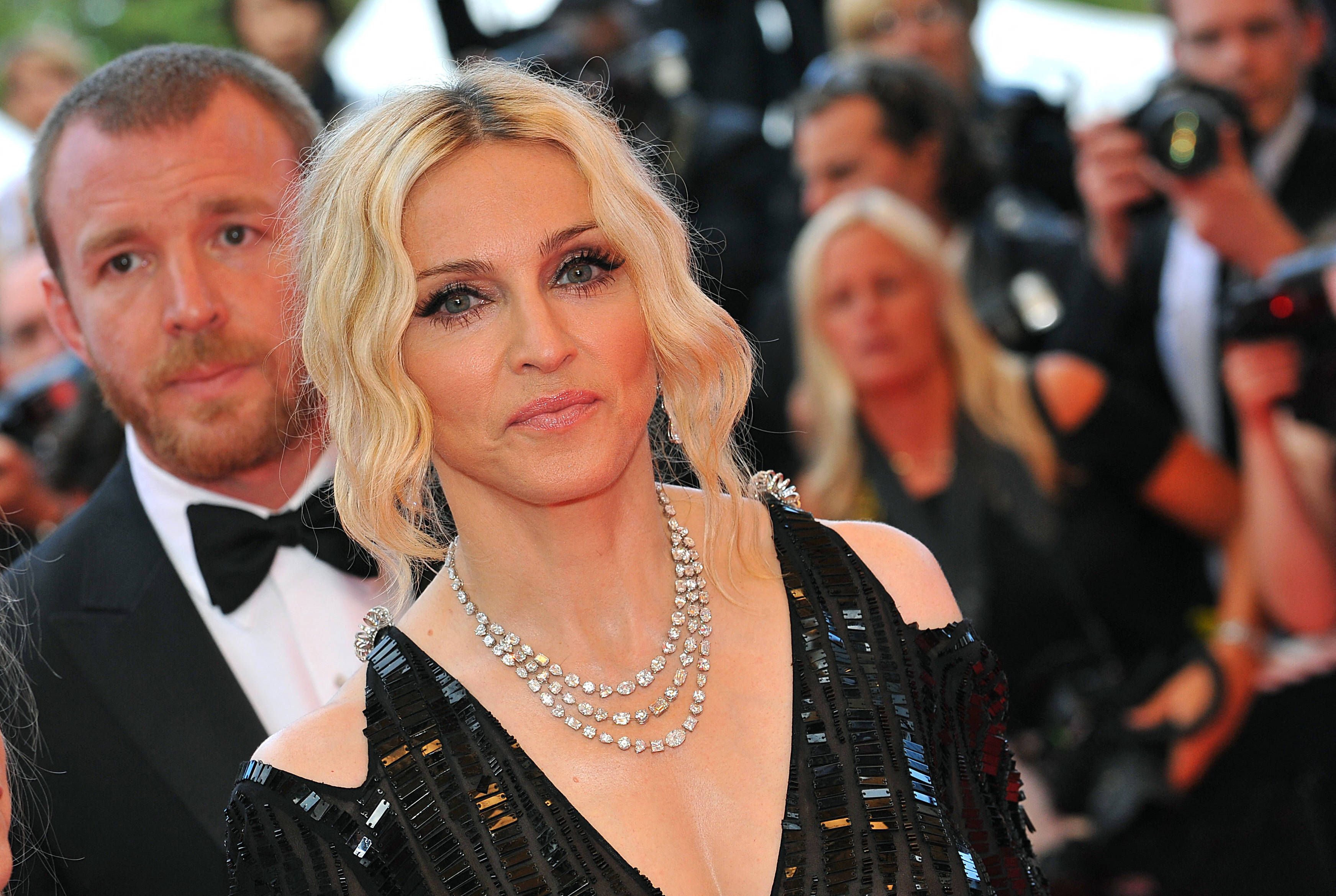 Madonna Postpones Tour After Suffering Serious Bacterial Infection File photo dated May 21, 2008 of Guy Ritchie and Madonna seen arriving at the Palais des Festivals in Cannes, Southern France, for the screening of Steven Soderbergh s Che presented in competition at the 61st Cannes Film Festival. Madonnas upcoming Celebration tour has been postponed after the singer was hospitalized with a serious bacterial infection, according to an Instagram post from her longtime manager Guy Oseary. The tour was scheduled to kick off in Vancouver on 15 July. Photo by Hahn-Nebinger-Orban/ABACAPRESS.COM Cannes France PUBLICATIONxNOTxINxFRAxSPAxUKxUSAxBELxPOL Copyright: xHahn-Nebinger-Orban/ABACAx 858824_004 Hahn-Nebinger-Orban/ABACAx 858824_004