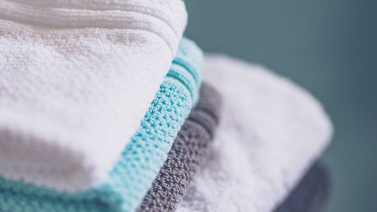Stack of freshly laundered towels and washcloths