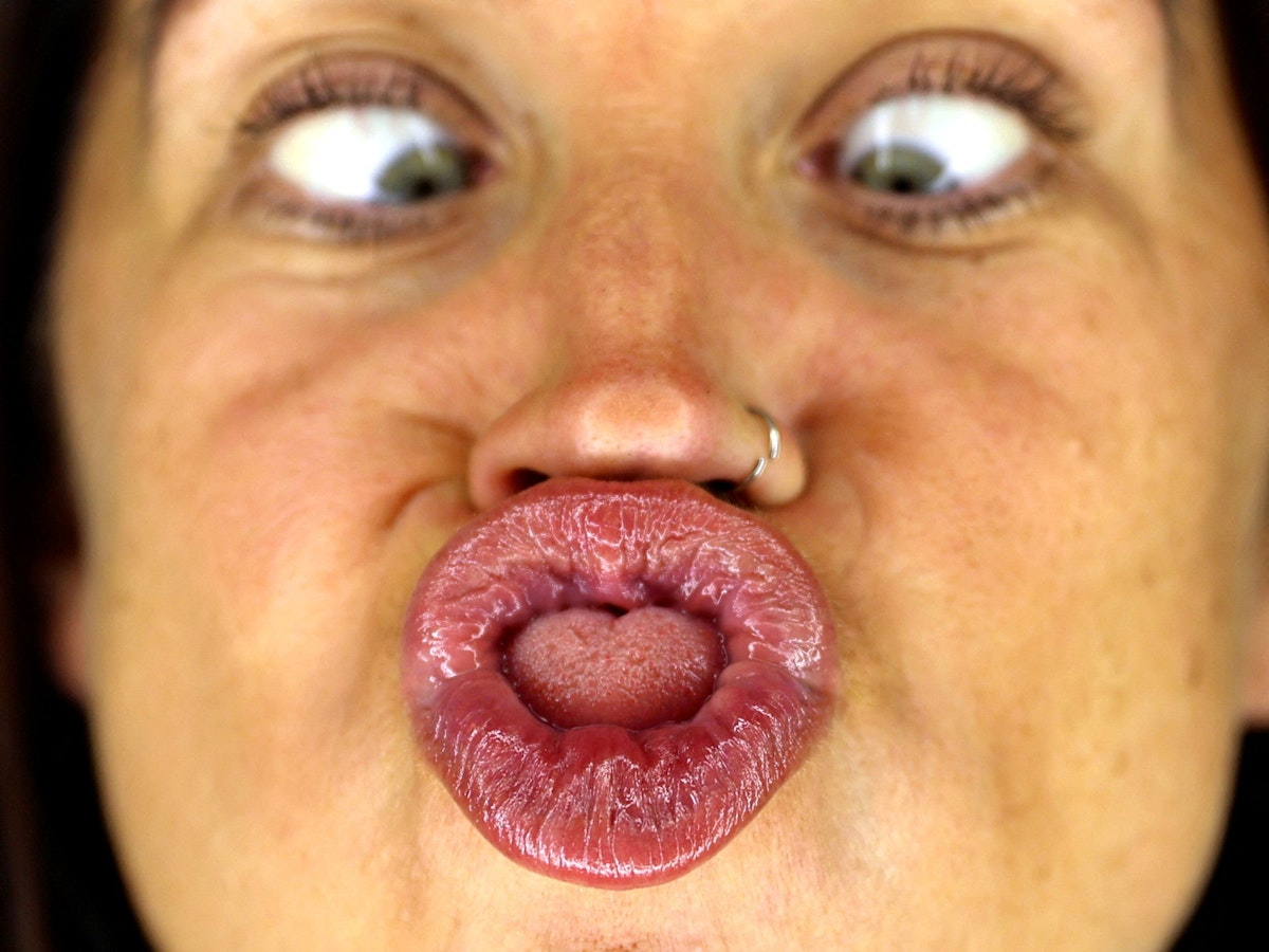 Female gurning champion Claire Lister practises ahead of the World Gurning Championships to be held in the Egremont Crab Fair in Egremont, Britain September 15, 2023. REUTERS/Lee Smith