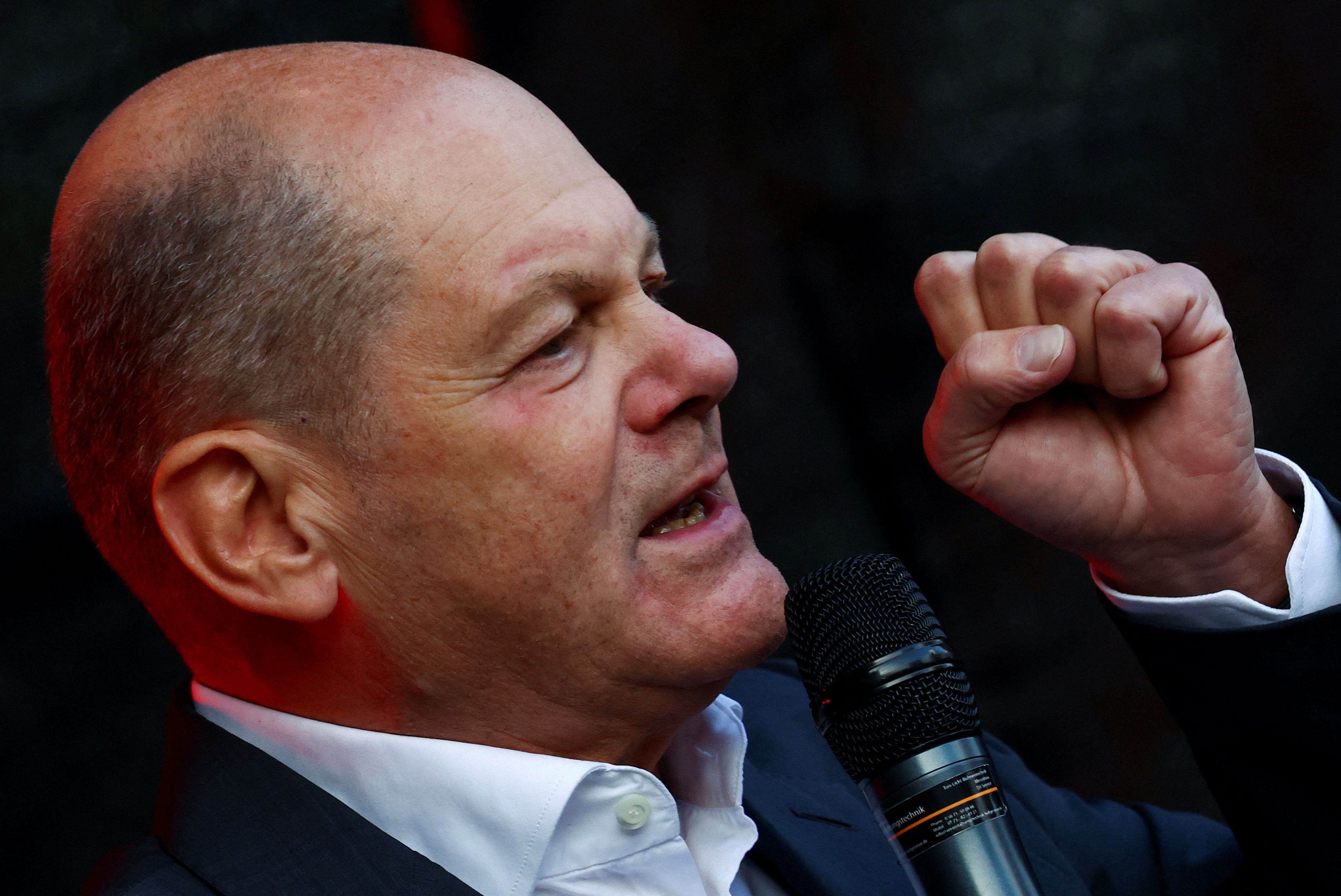 German Chancellor Olaf Scholz speaks as he attends an election campaign rally for his Social Democratic party (SPD) fellow, Germany's Interior Minister and top candidate for the Hesse state elections, Nancy Faeser, in Baunatal, Germany, September 23, 2023. REUTERS/Kai Pfaffenbach