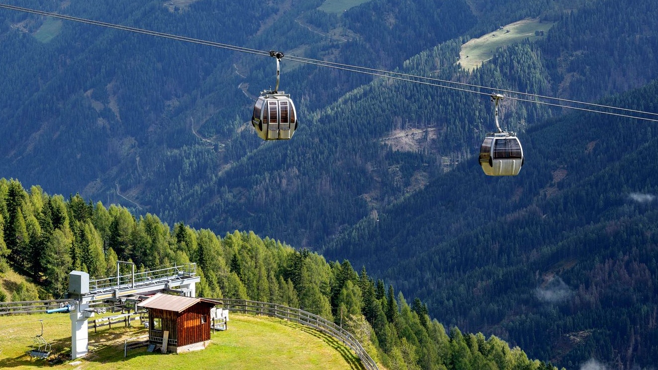 gondola cableway at the mountain Turnthaler with the mountain range Lienzer Dolomites in the background, Austria