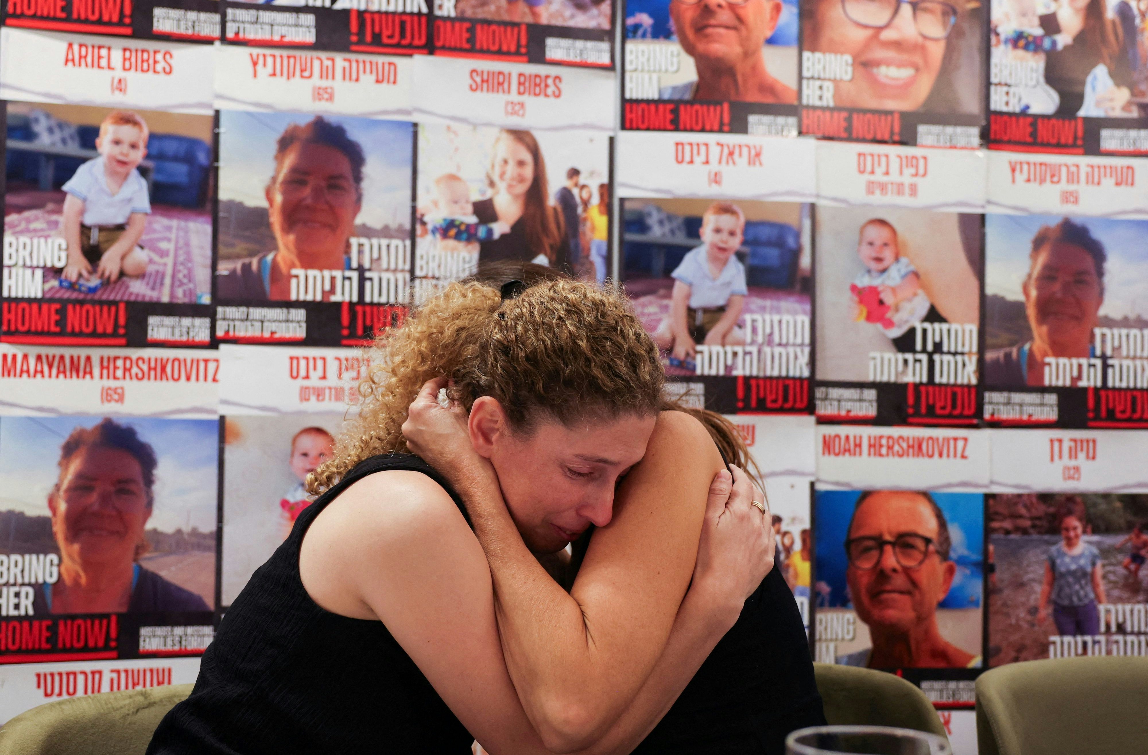 Dr. Adva Gutman-Tirosh and Lee Dan, whose family members were abducted, comfort each other as the families of people who are missing or were abducted from Israel, following a deadly infiltration by Hamas gunmen from the Gaza Strip, hold a press conference asking for a humanitarian corridor for the transfer of medicine and humanitarian aid for captives who require life-saving medical treatment, in Tel Aviv, Israel, October 14, 2023. REUTERS/Ronen Zvulun REFILE - QUALITY REPEAT     TPX IMAGES OF THE DAY     