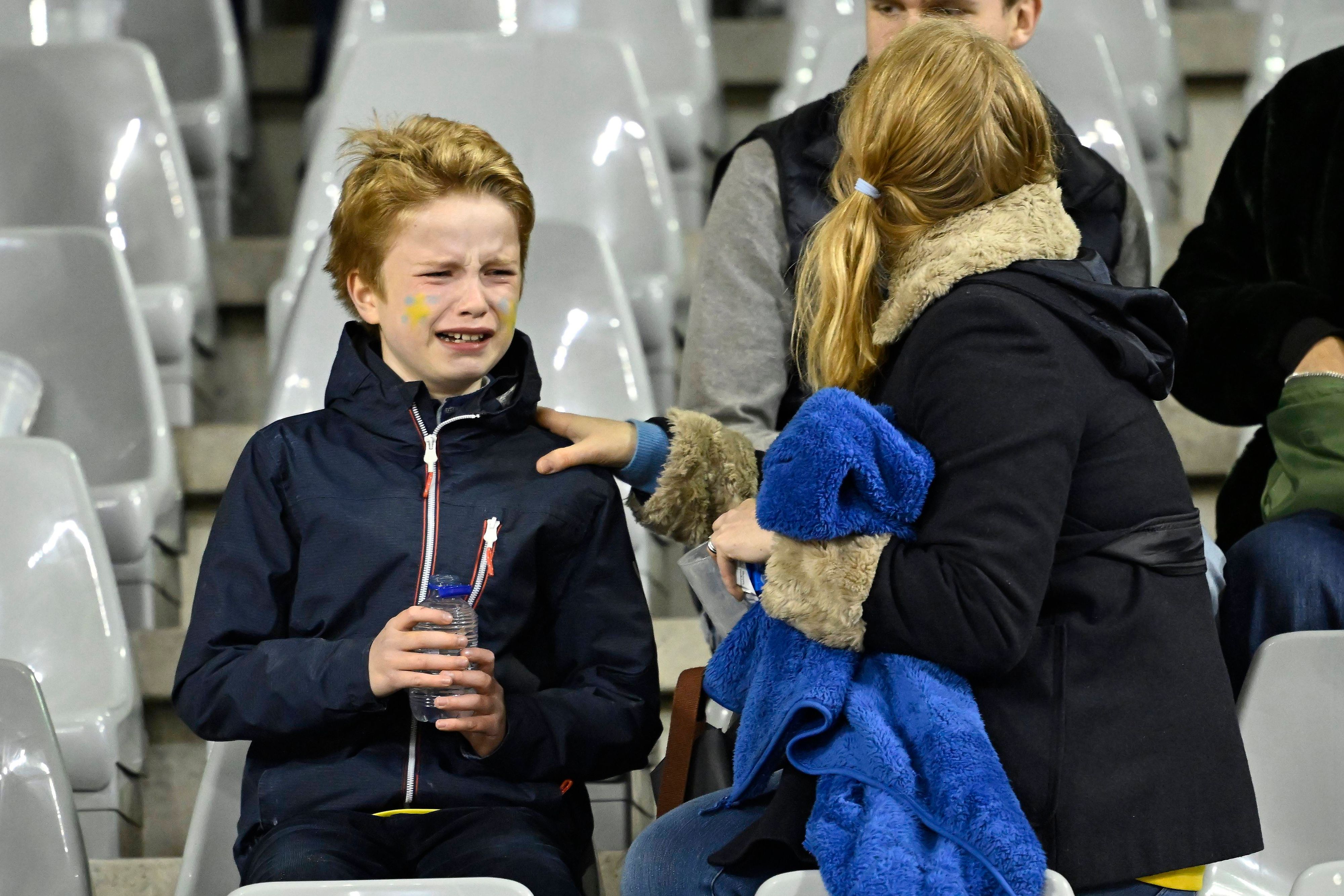 Belgium v Sweden - EURO 2024 Qualifier BRUSSELS, BELGIUM - OCTOBER 16 : A young Swedish supporters in tears after the news of the attack on Swedish supporters during the UEFA EURO, EM, Europameisterschaft,Fussball 2024 European Qualifier Group F match between Belgium and Sweden at the King Baudouin Stadium on October 16, 2023 in Brussels, Belgium, 16/10/2023 Brussels Belgium PUBLICATIONxNOTxINxFRAxBEL Copyright: xNicoxVereeckenx