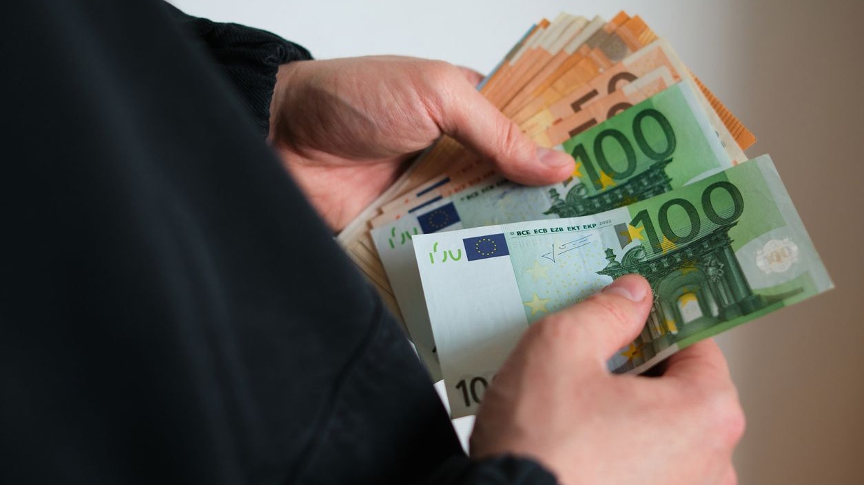 Man holds money in his hands. Cash in euro for payment or exchange. Male counts salary in euro banknotes. Saving money, withdrawal banking deposit. European money. Financial crisis. Hands close-up