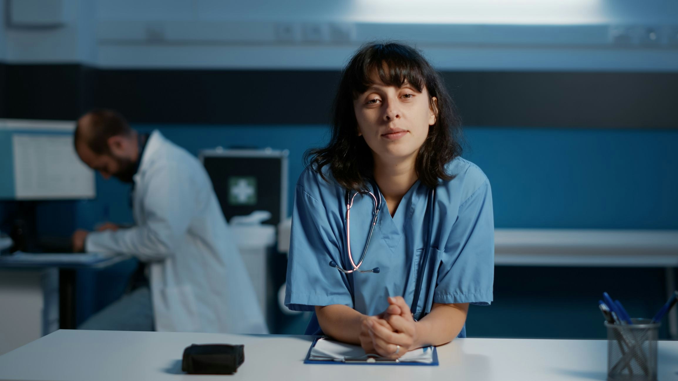 Pov of medical assistant talking with remote doctor during online videocall meeting discussing patient illness expertise planning health care treatment. Nurse working night shift in hospital office