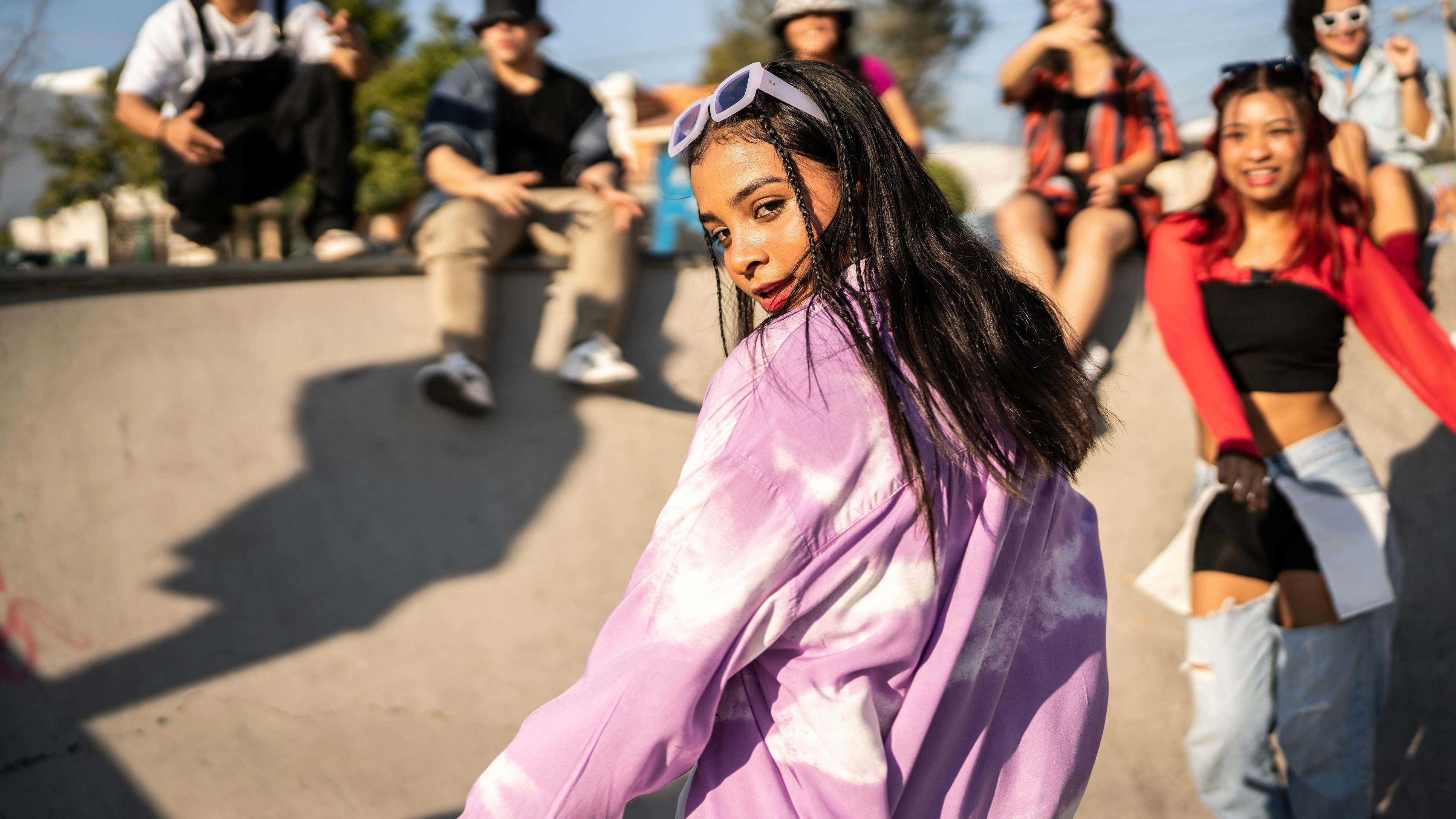 Portrait of young woman dancing at street party
