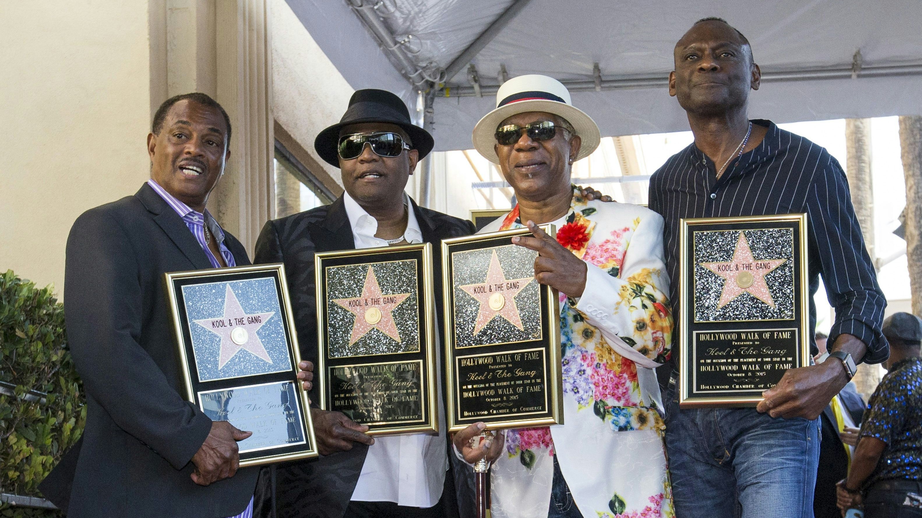 Music group "Kool & the Gang", Ronald Bell, Robert "Kool" Bell, Dennis Thomas and George Brown (L-R) pose after unveiling their star on the Hollywood Walk of Fame in Los Angeles, California, October 8, 2015. 