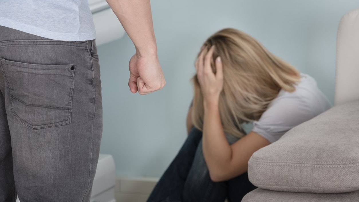 Close-up Of A Man Threatening Woman By Showing His Fist