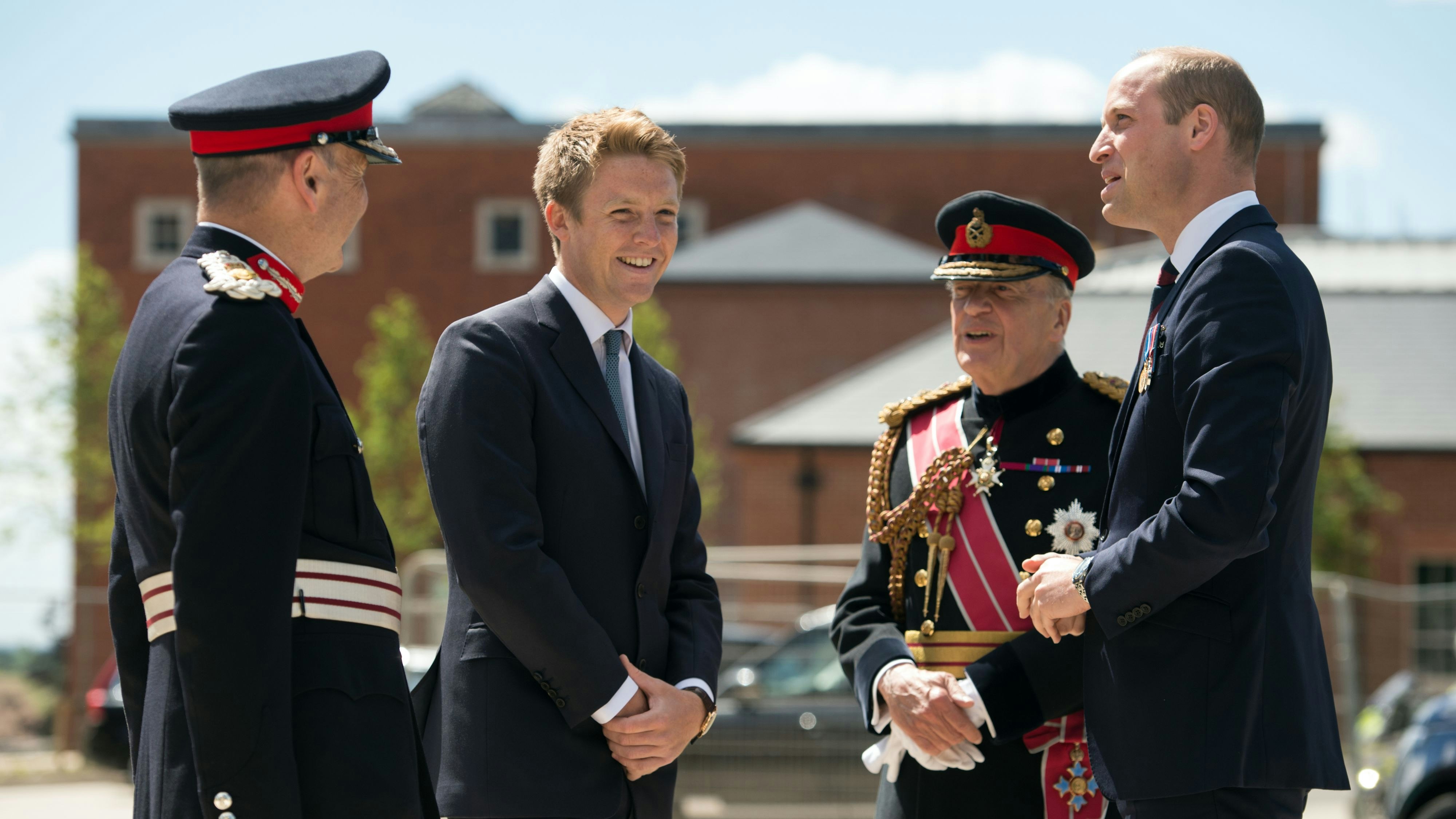 Britain's Prince William, Duke of Cambridge (R) is greeted by General Timothy Granville-Chapman (2R), Hugh Grosvenor, the Duke of Westminster (2L) and John Peace (L) as he arrives to attend the official handover of the newly built Defence and National Rehabilitation Centre (DNRC), which will provide world-class rehabilitation facilities for members of the Armed Forces, on the Stanford Hall Estate in Nottinghamshire.