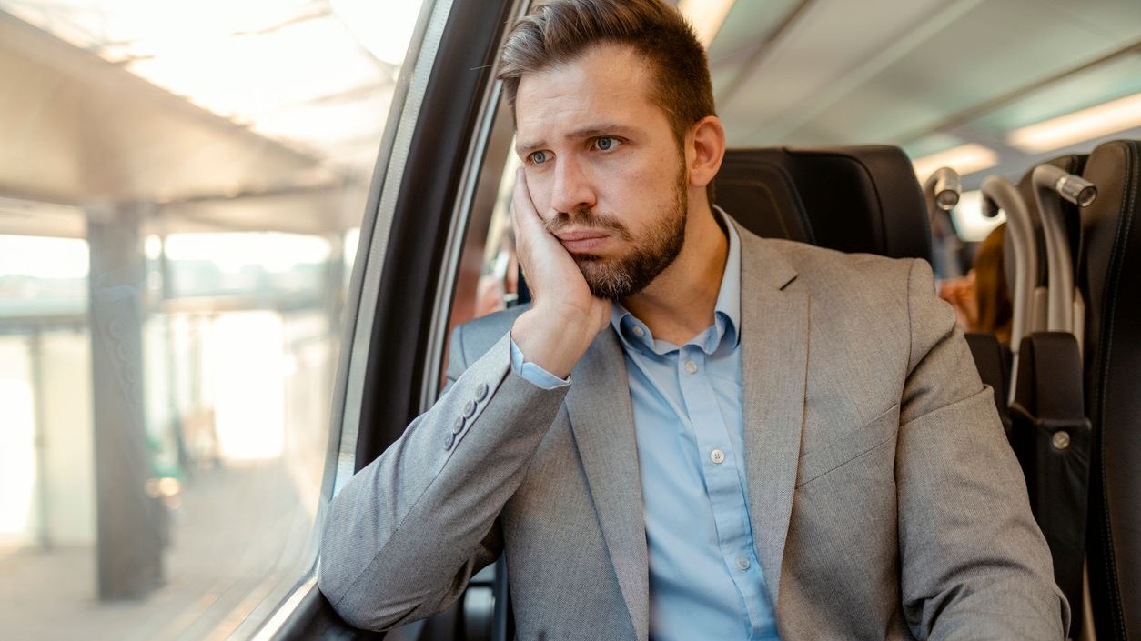 Anxious Man Commuting on Train