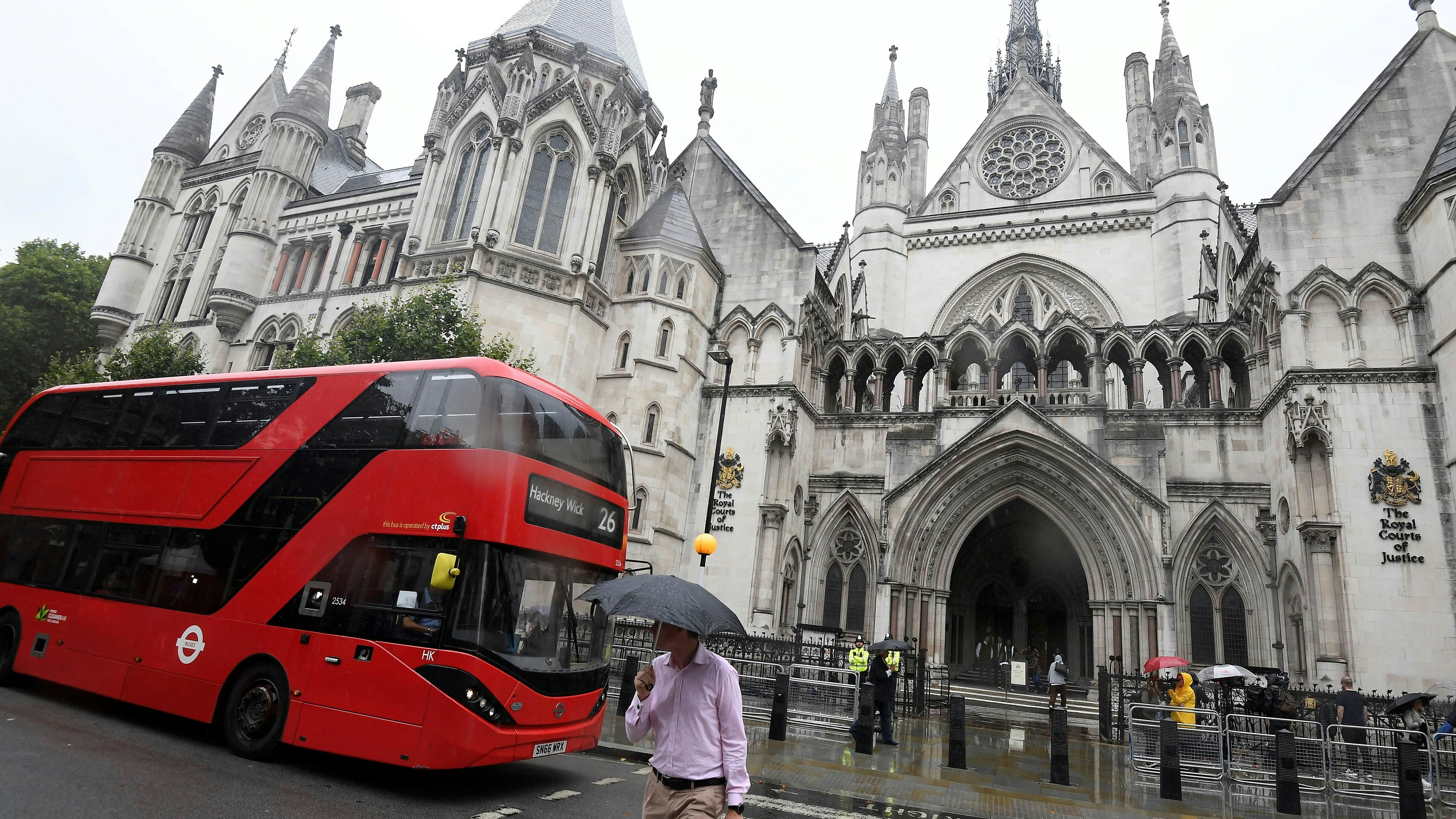 A London bus is driven past The Royal Courts of Justice in London, Britain, July 30, 2019. REUTERS/Toby Melville