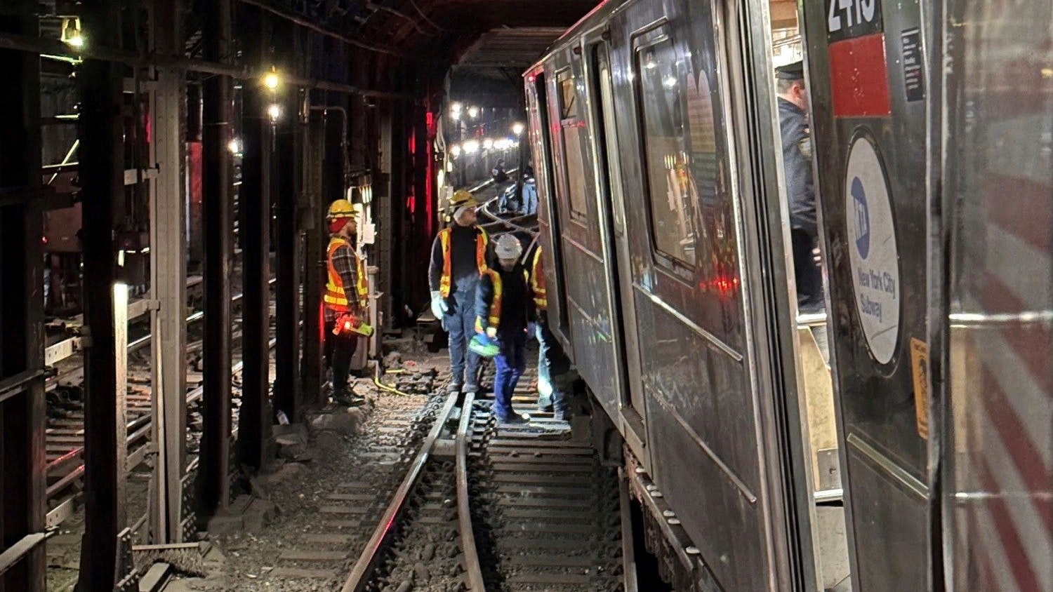 Crew members assess derailed train in New York, U.S.,  January 4, 2024 in this handout image. NYC EMERGENCY MANAGEMENT/Handout via REUTERS.  THIS IMAGE HAS BEEN SUPPLIED BY A THIRD PARTY. NO RESALES. NO ARCHIVES. MANDATORY CREDIT    
