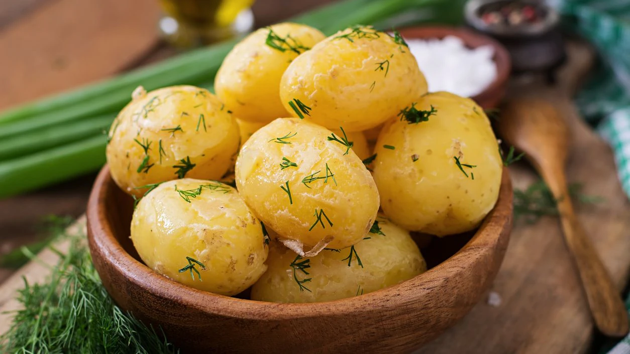 Boiled new potatoes seasoned with dill and butter