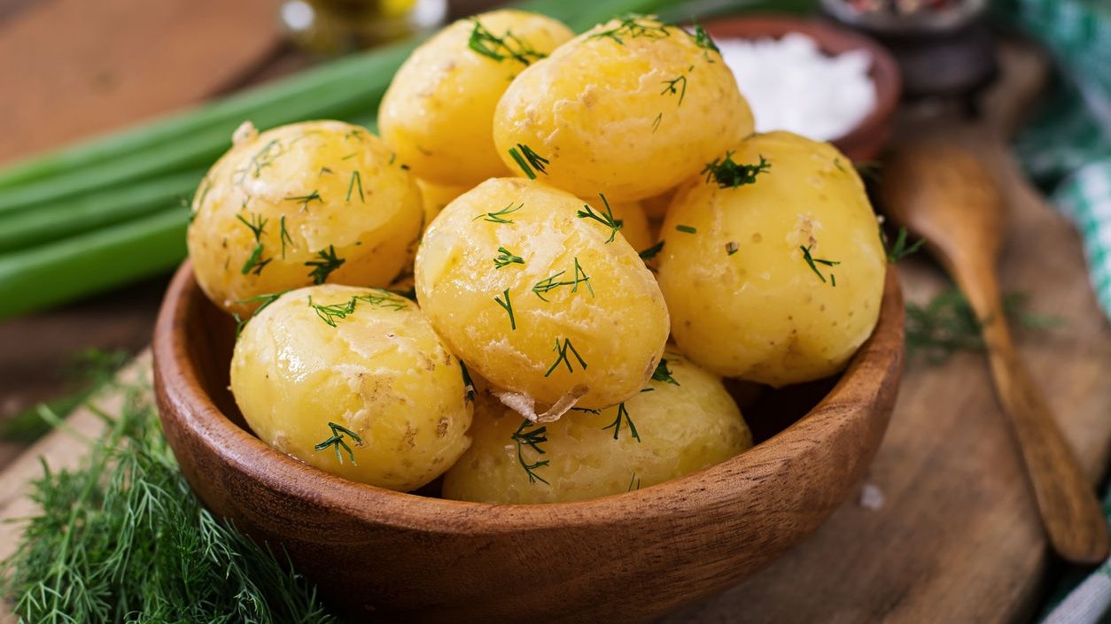 Boiled new potatoes seasoned with dill and butter