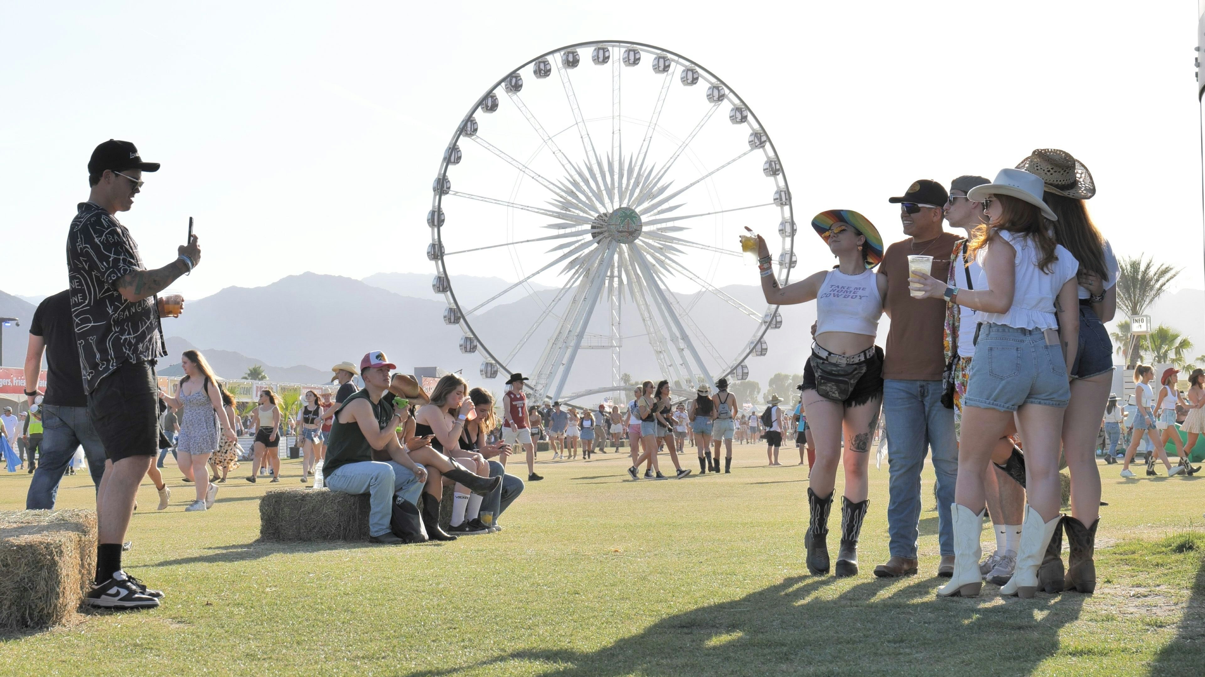 Photograph  showing  attendees  in  country  western  attire  taking  selfies  at  the  April  2023  Stagecoach  Music  Festival,  in  Indio  California. xkwx live,  influencers,  livestream,  music,  bands,  event,  entertainment,  world,  love,  friends,  concert,  western,  country,  travel,  tourism,  destination,  desert,  sunshine,  palm  springs,  coachella,  festival,  fun,  famous,  celebrities,  kardashians,  jenner,  selfie,  heat,  vacation,  family,  celebration,  art,  bar-b-que,  beer,  jamisons,  fashion,  dancing,  camping,  rv,  golden  voice