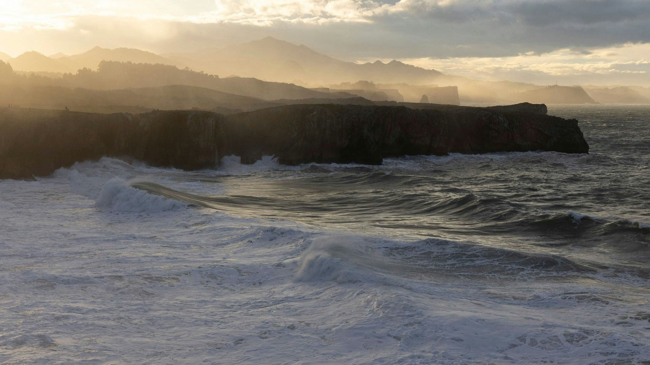 Landscape of big ocean waves on windy sunny day at the atlantic northern coast of Spain in Asturias