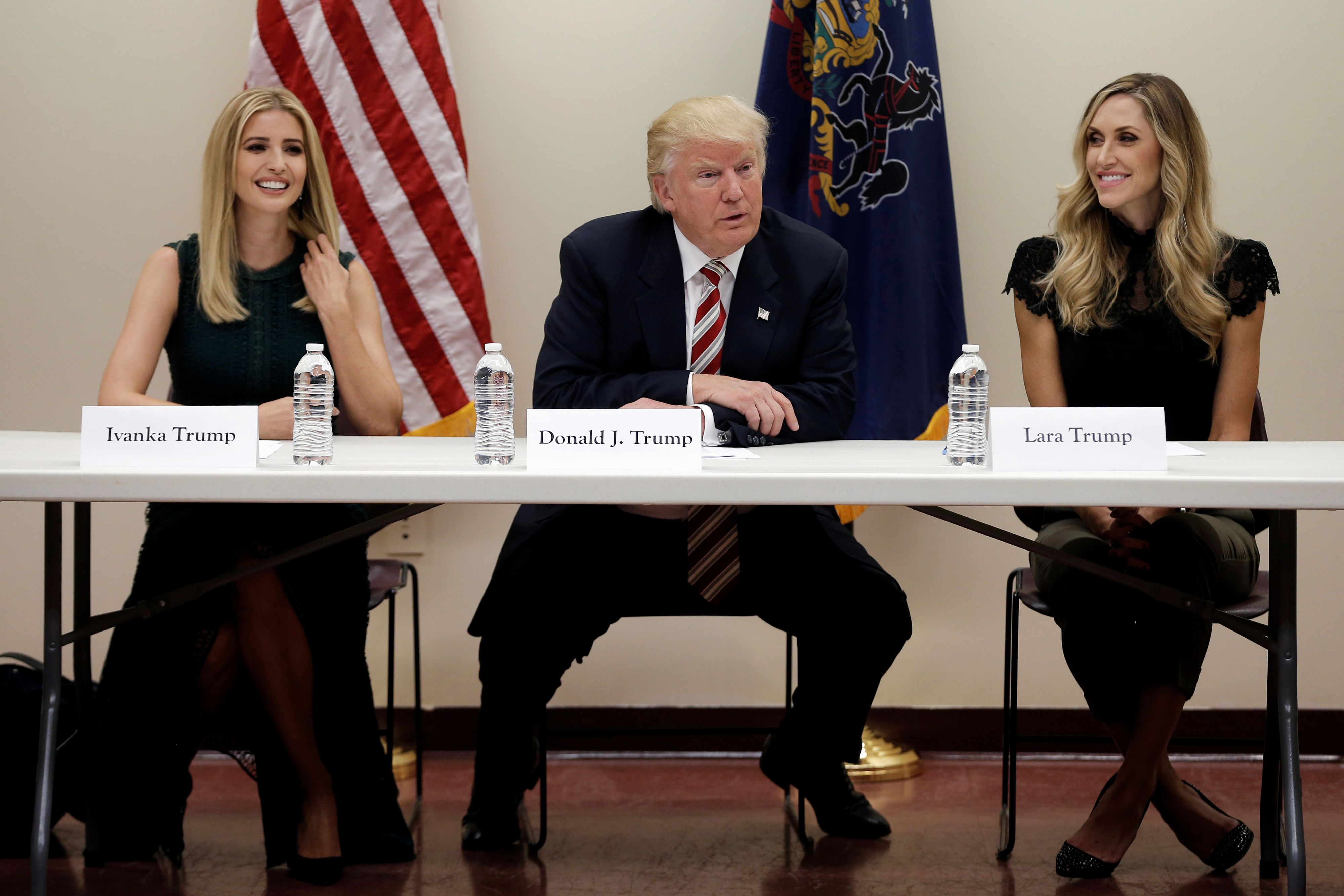 Republican presidential nominee Donald Trump and his daughter Ivanka (L) and daughter in-law Lara Trump (R) attend a round table meeting on child care issues before a campaign event in Aston, Pennsylvania, U.S., September 13, 2016. REUTERS/Mike Segar