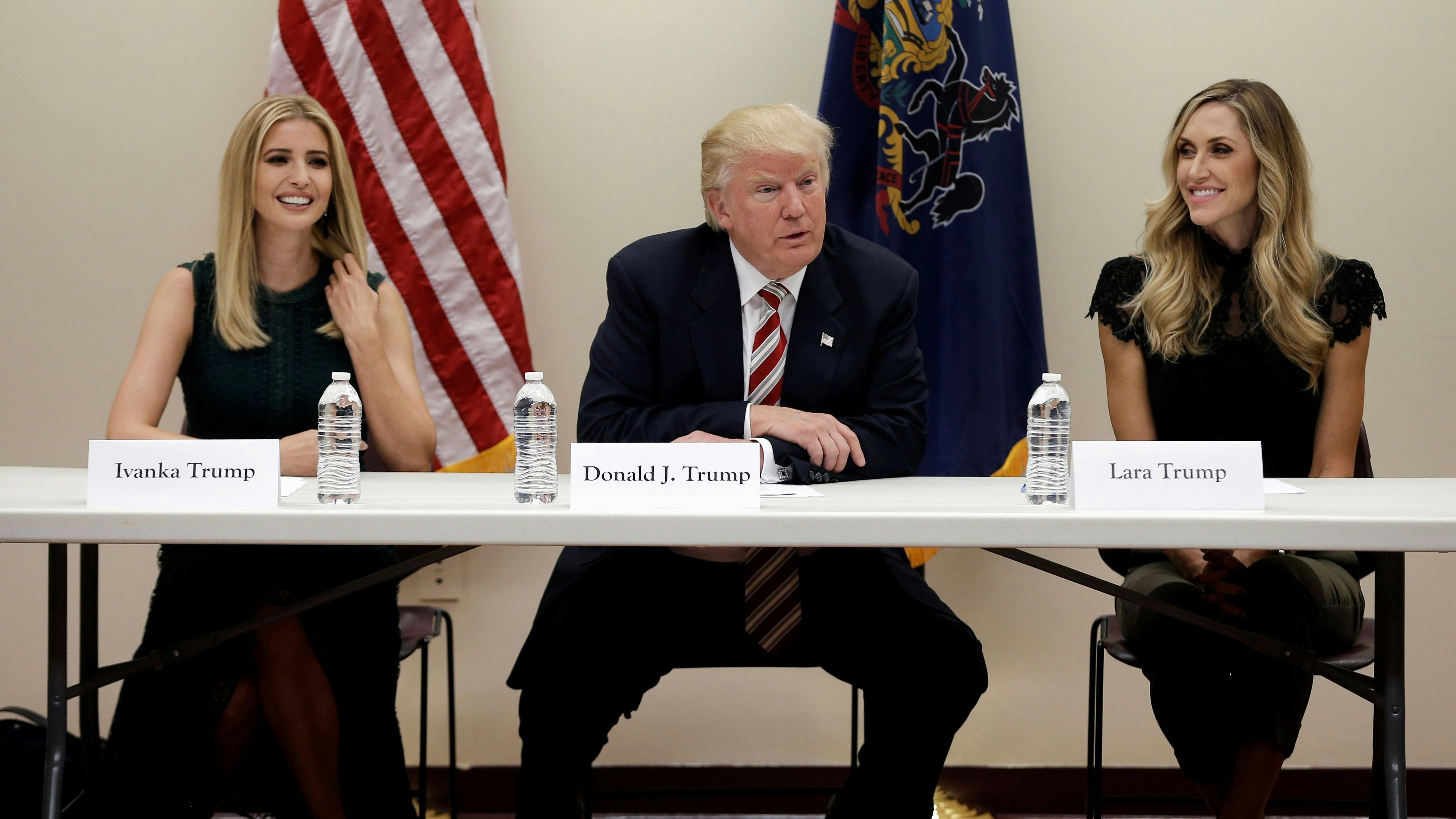 Republican presidential nominee Donald Trump and his daughter Ivanka (L) and daughter in-law Lara Trump (R) attend a round table meeting on child care issues before a campaign event in Aston, Pennsylvania, U.S., September 13, 2016. REUTERS/Mike Segar