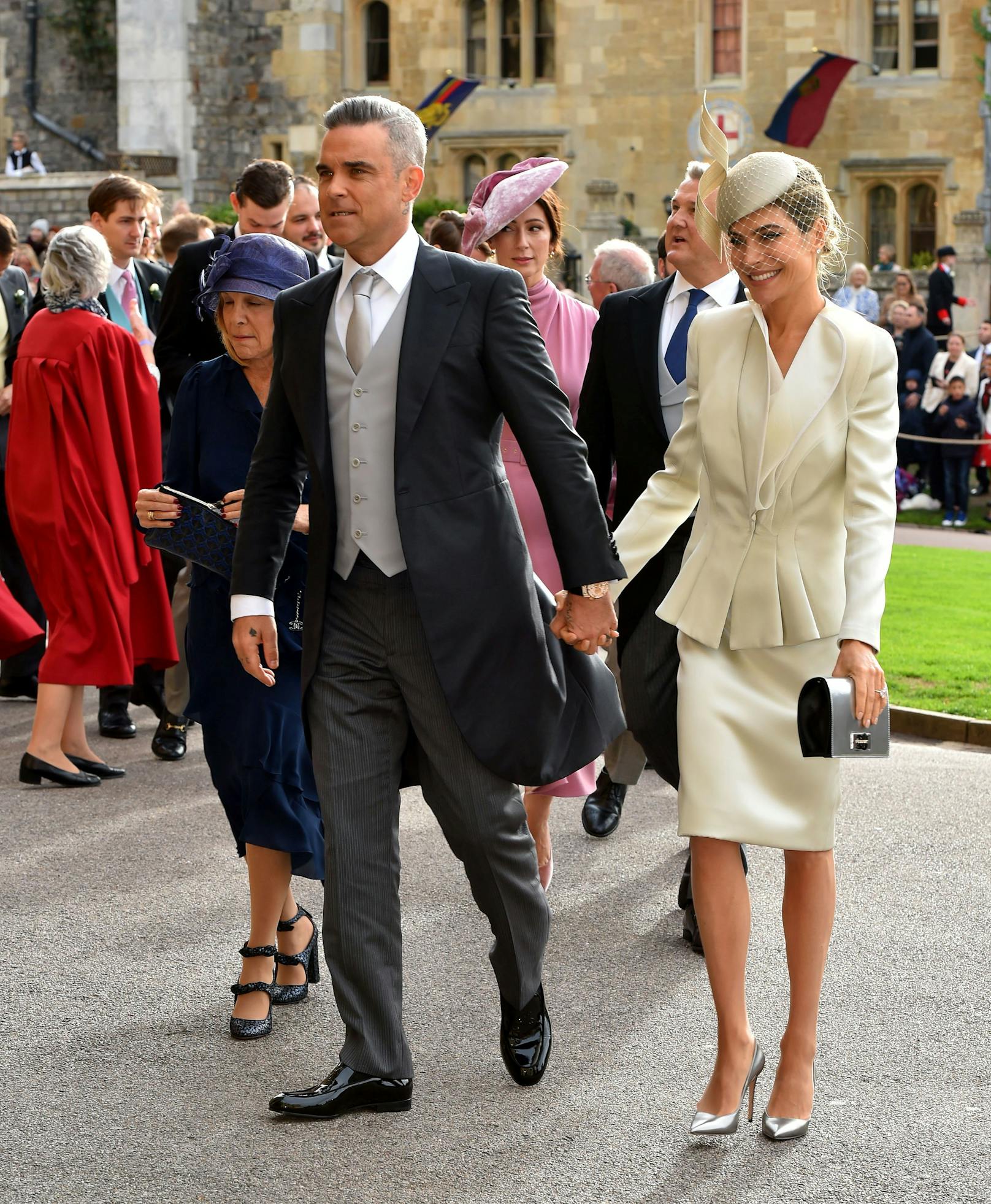 Robbie Williams und Ayda Field zeigen sich gerne zusammen in der Öffentlichkeit - wie hier bei der royalen Hochzeit von Prinzessin Eugenie und Jack Brooksbank 2018.
